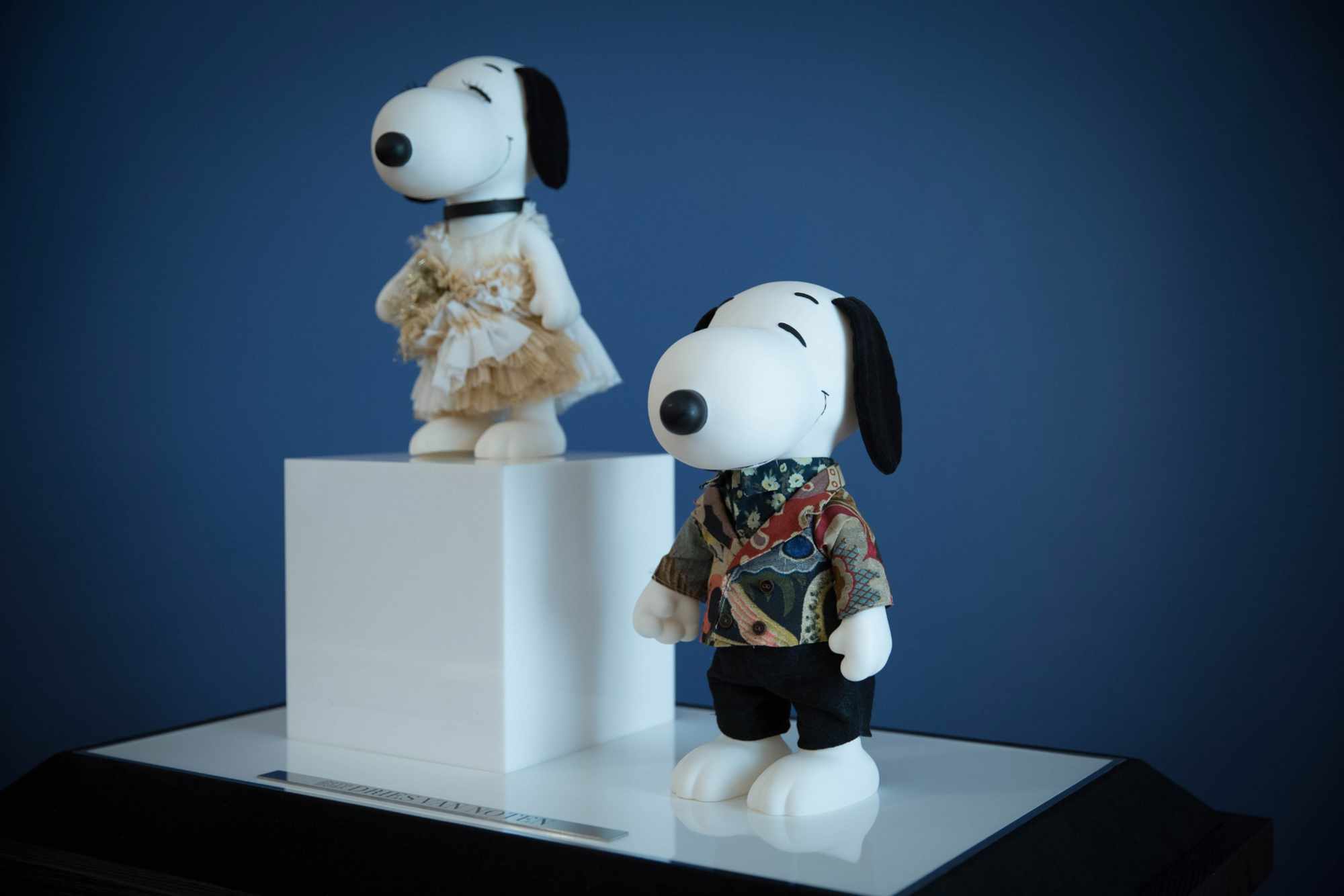 Snoopy and Belle figures at a fashion doll event