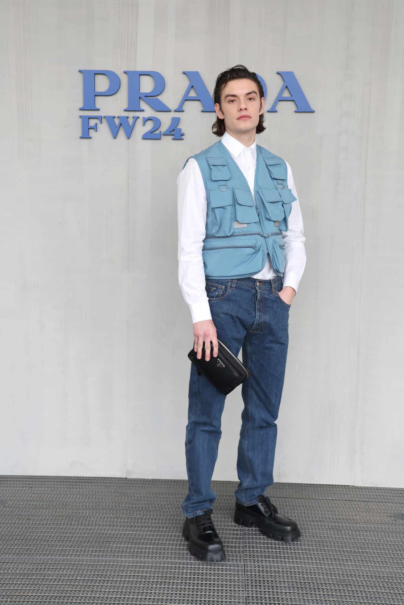 Louis Partridge attends the 2024 Prada menswear fashion show