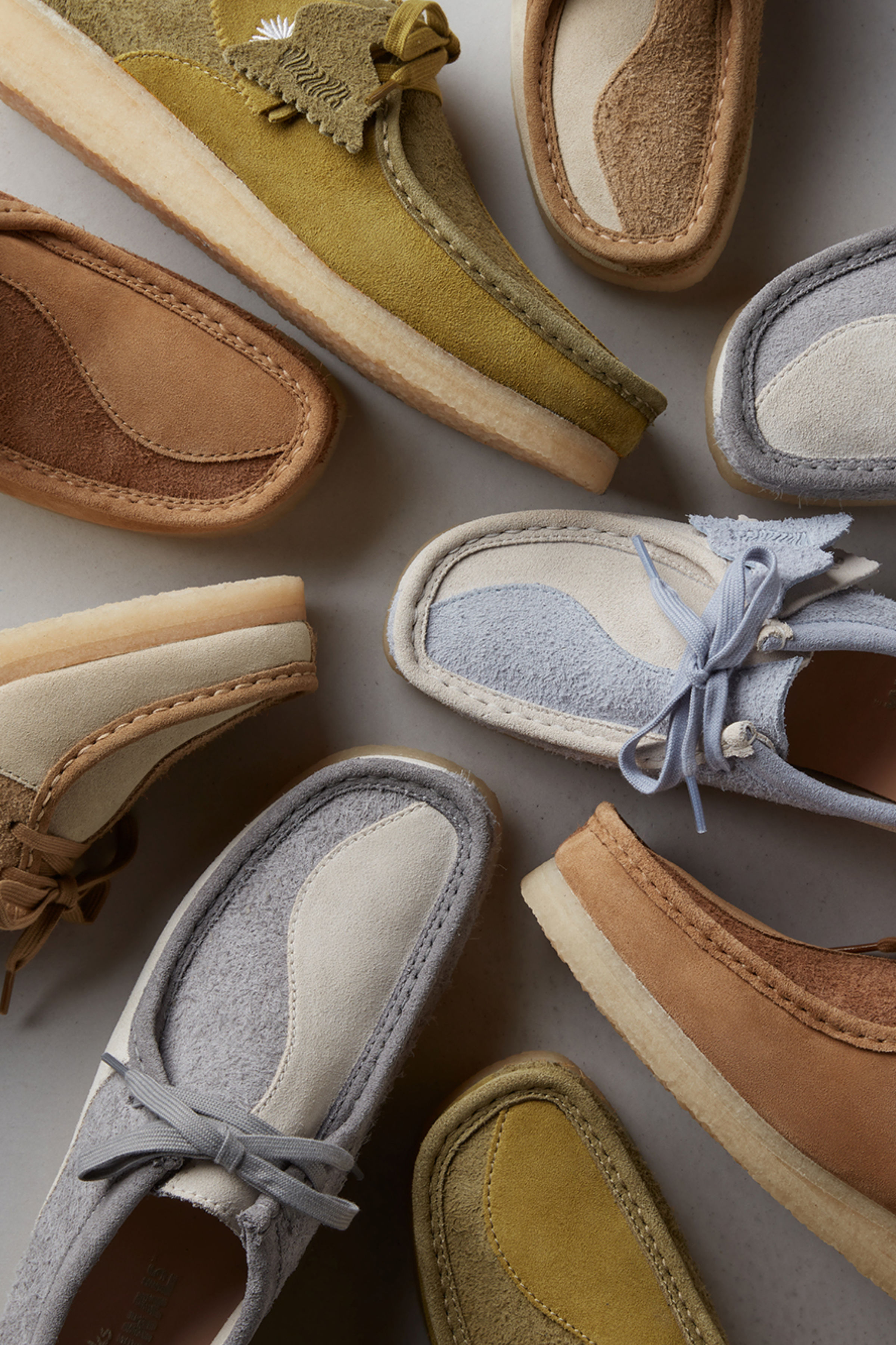 A jumbled collection of Clarks Wallabees, in various colours