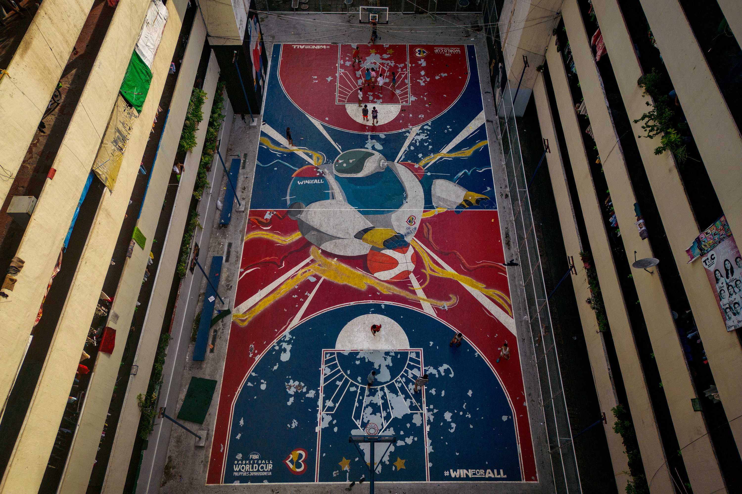 mural of JIP, the FIBA World Cup mascot, is seen painted on a basketball court at a tenement building ahead of the FIBA World Cup on August 22, 2023 in Taguig, Metro Manila, Philippines.