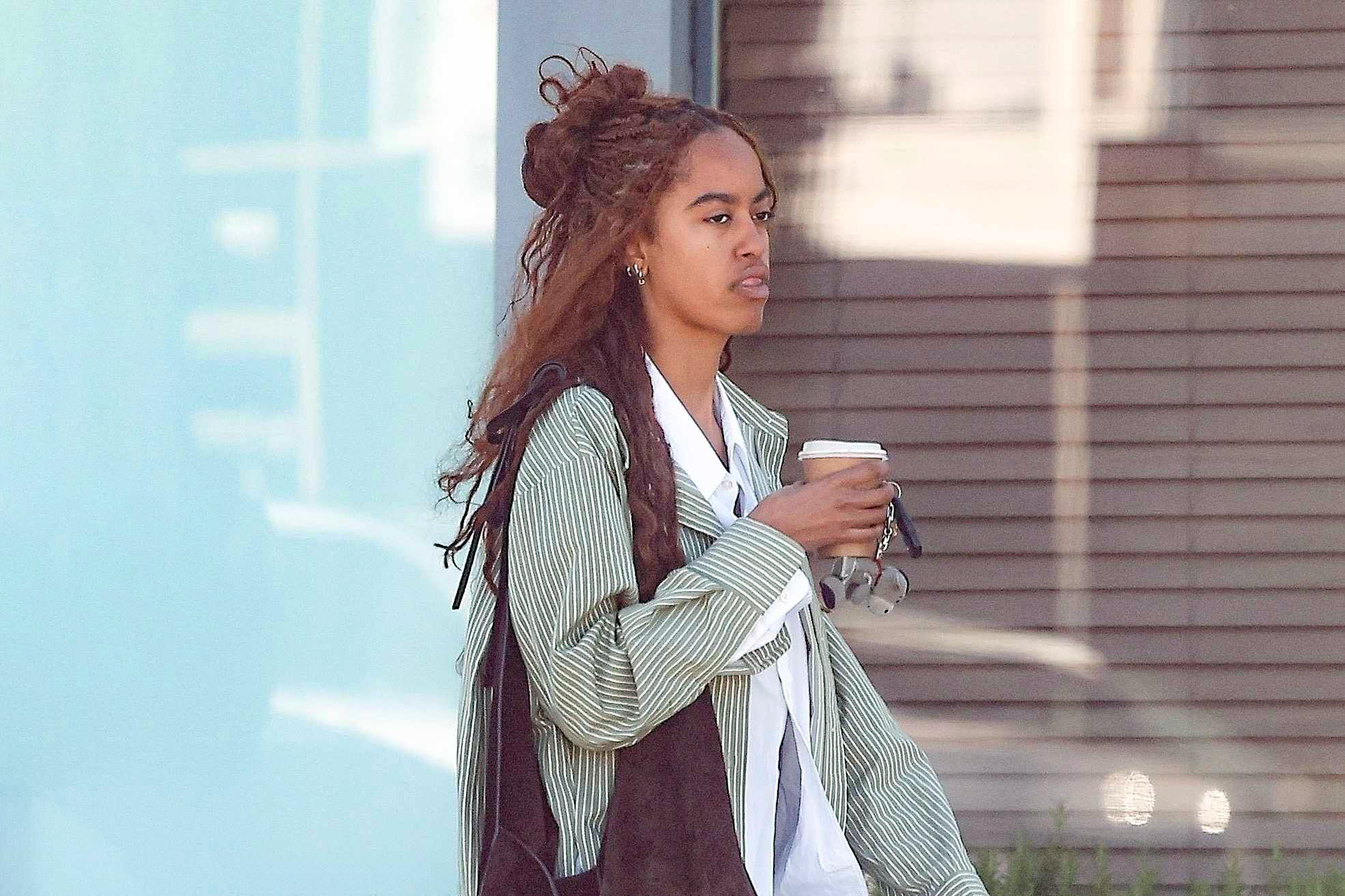Malia Obama seen in Los Angeles attending an acting class with a striped shirt, white shirt, blue jeans, and black shoes