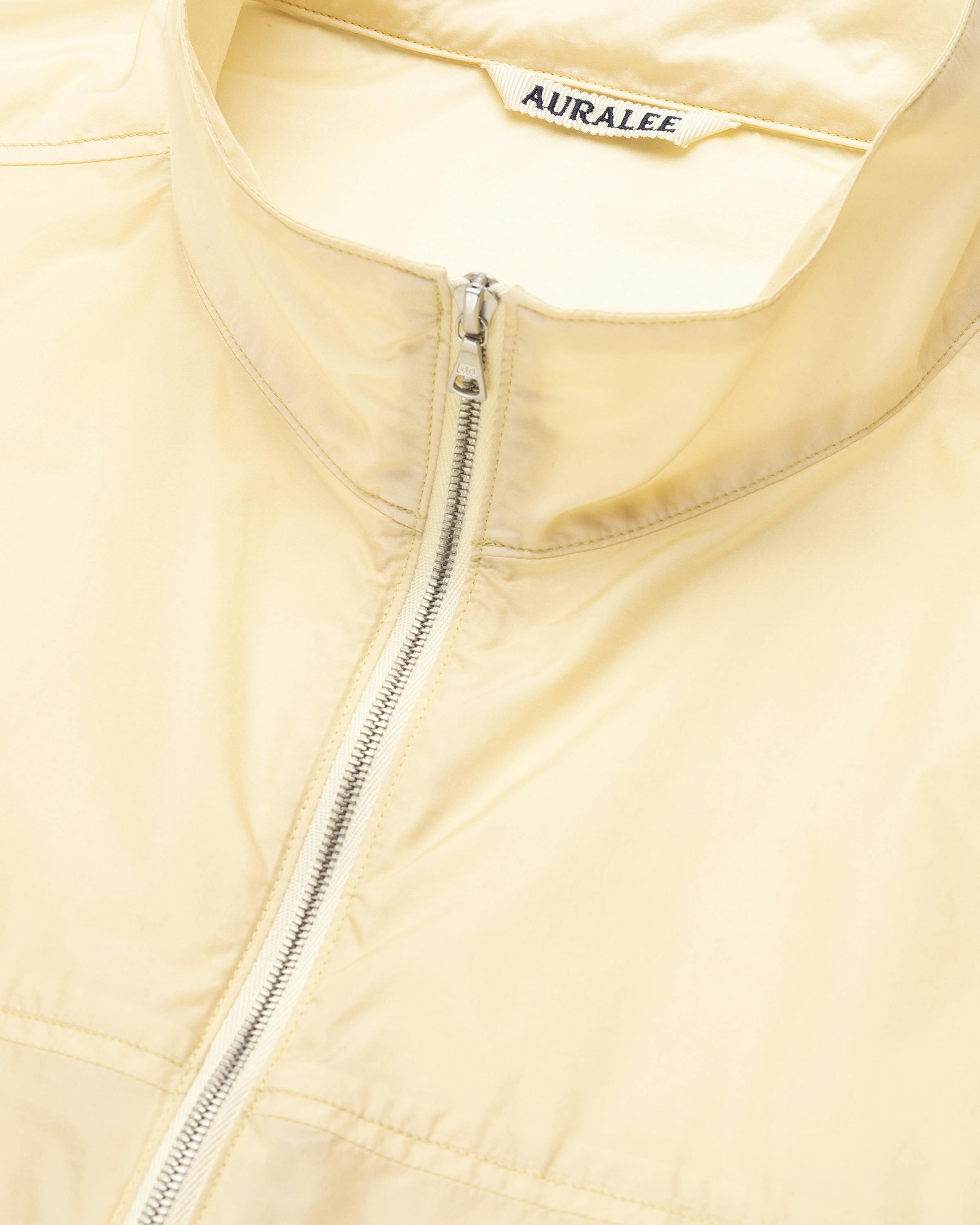 Auralee – Light Nylon Half Zip P/O Light Yellow
