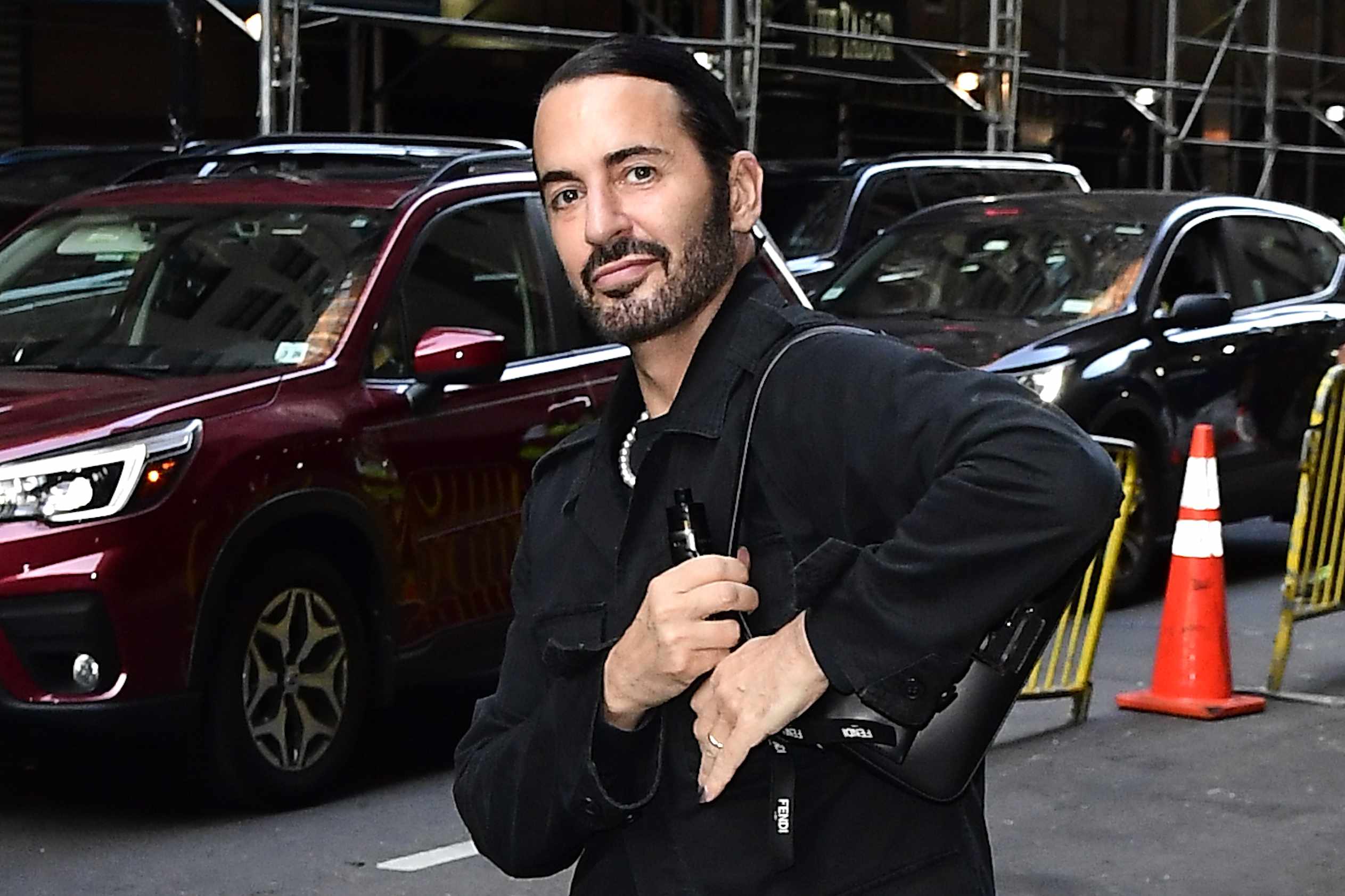 Designer Marc Jacobs wears a black outfit with a dark Fendi handbag in New York