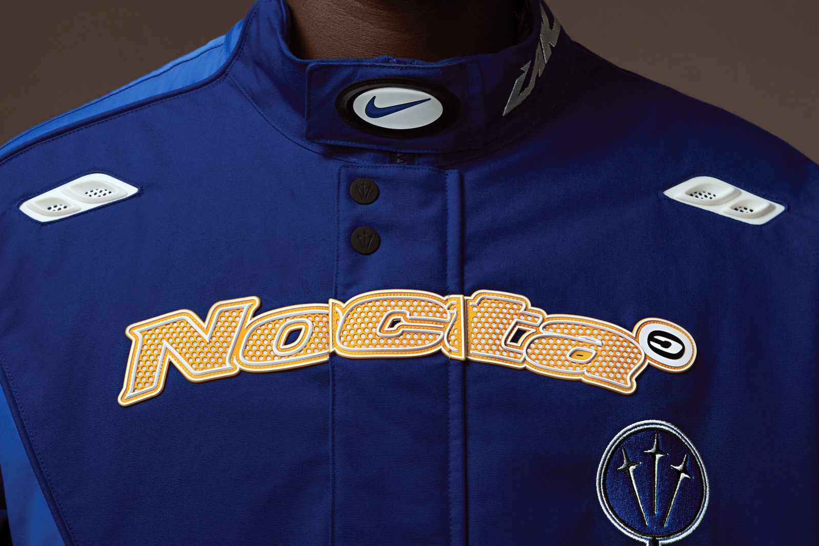 Nocta Nike & L'art de l'automobile's blue racing jacket collab