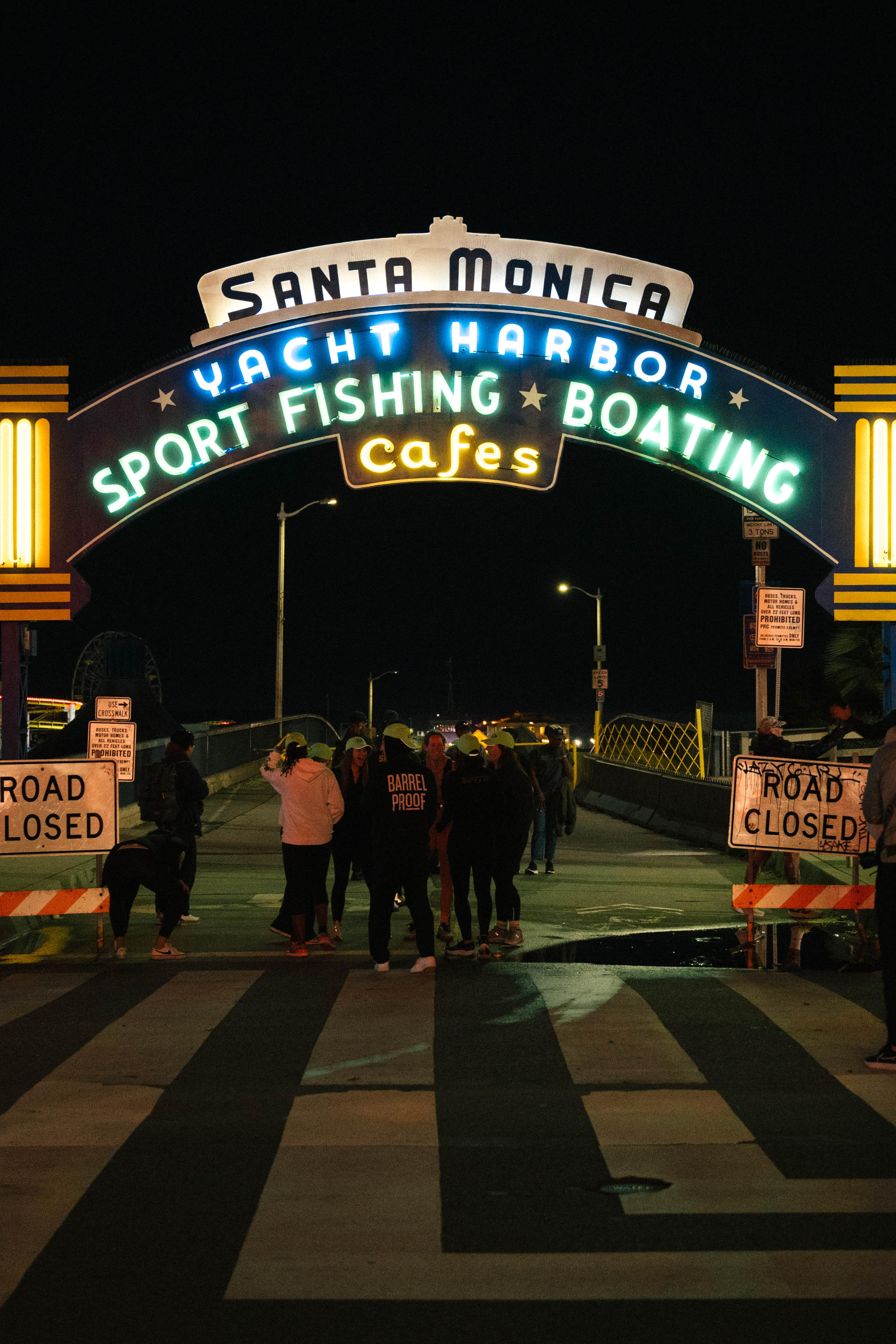 Welcome sign of Santa Monica at night with the road closed for a running race