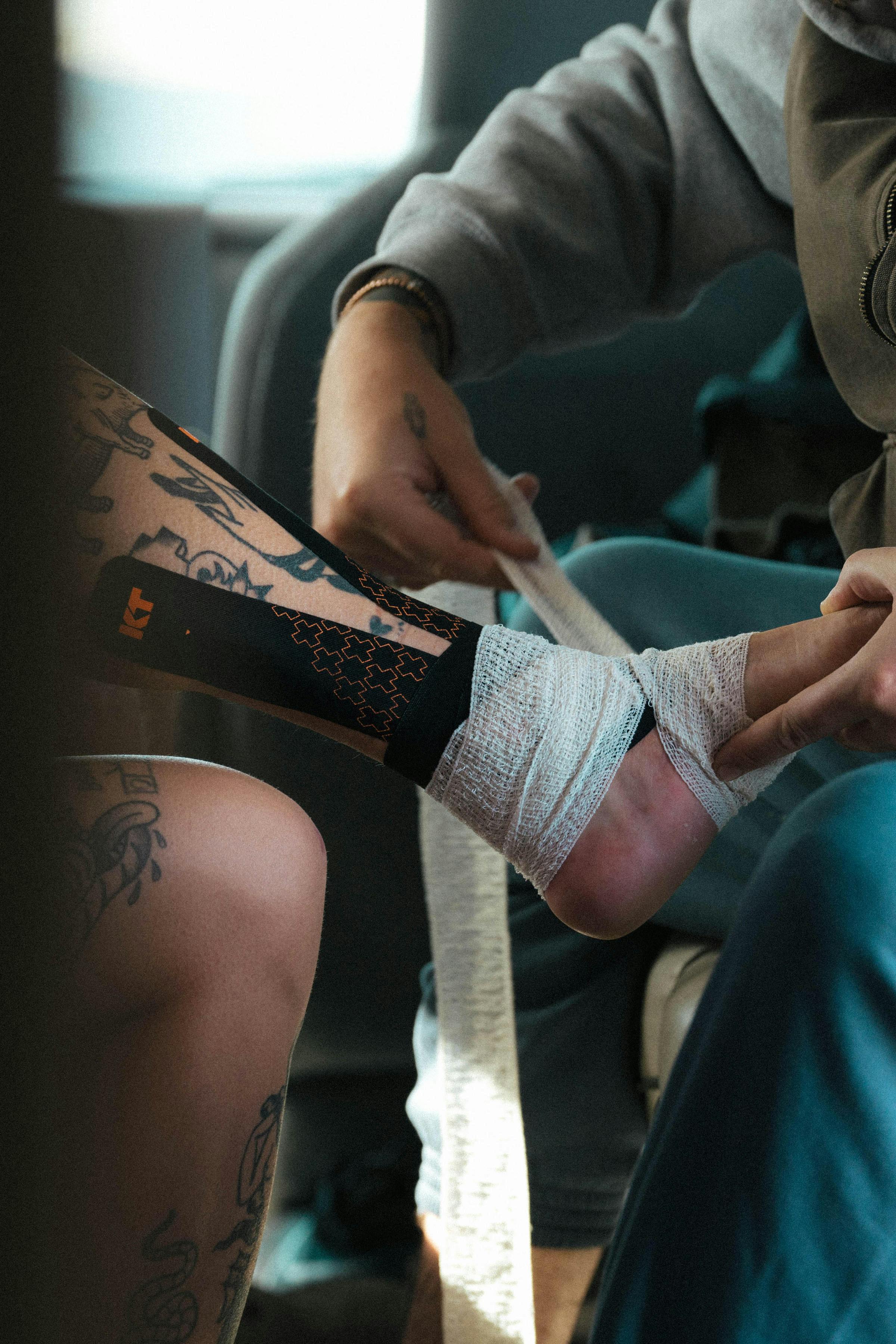 Close-up of an athlete's foot being bandaged