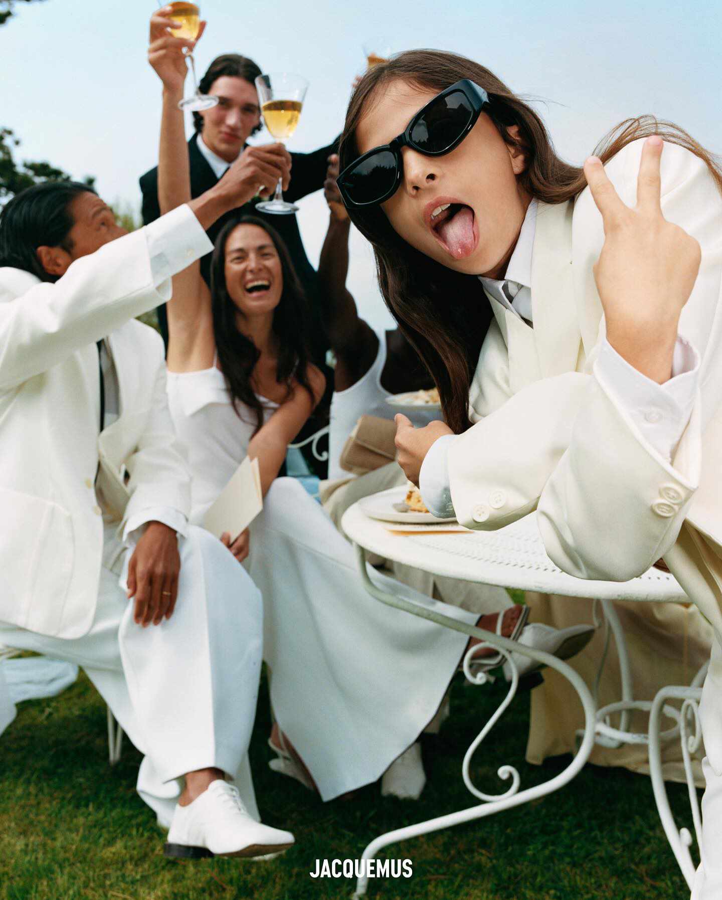 Jacquemus' le marriage wedding clothing collection with white suits, black ties, sunglasses