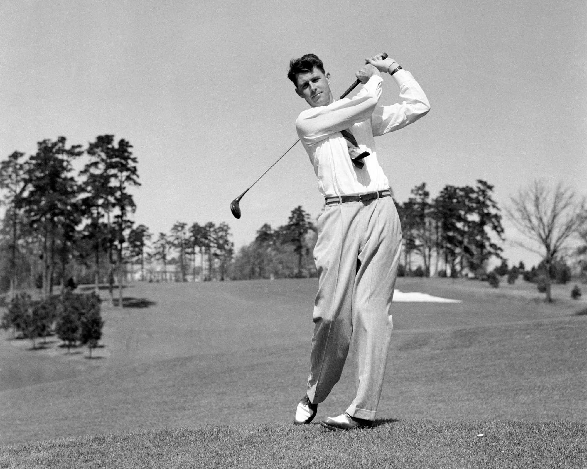 Horton Smith swings a golf club at the 1934 Augusta National golf tournament