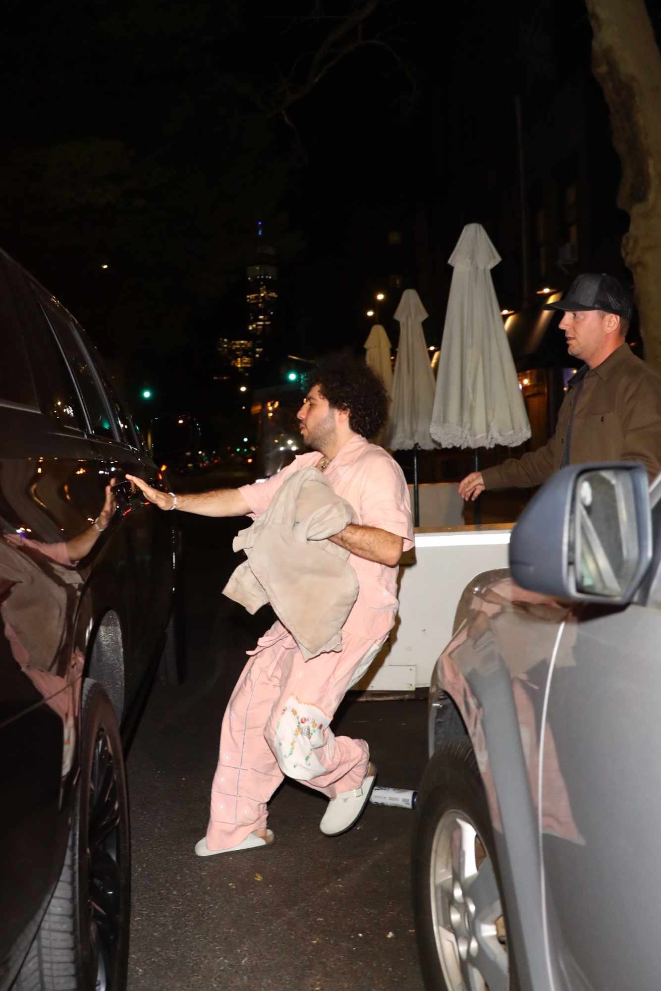Benny Blanco wearing a beige outfit with white Birkenstock Boston clogs