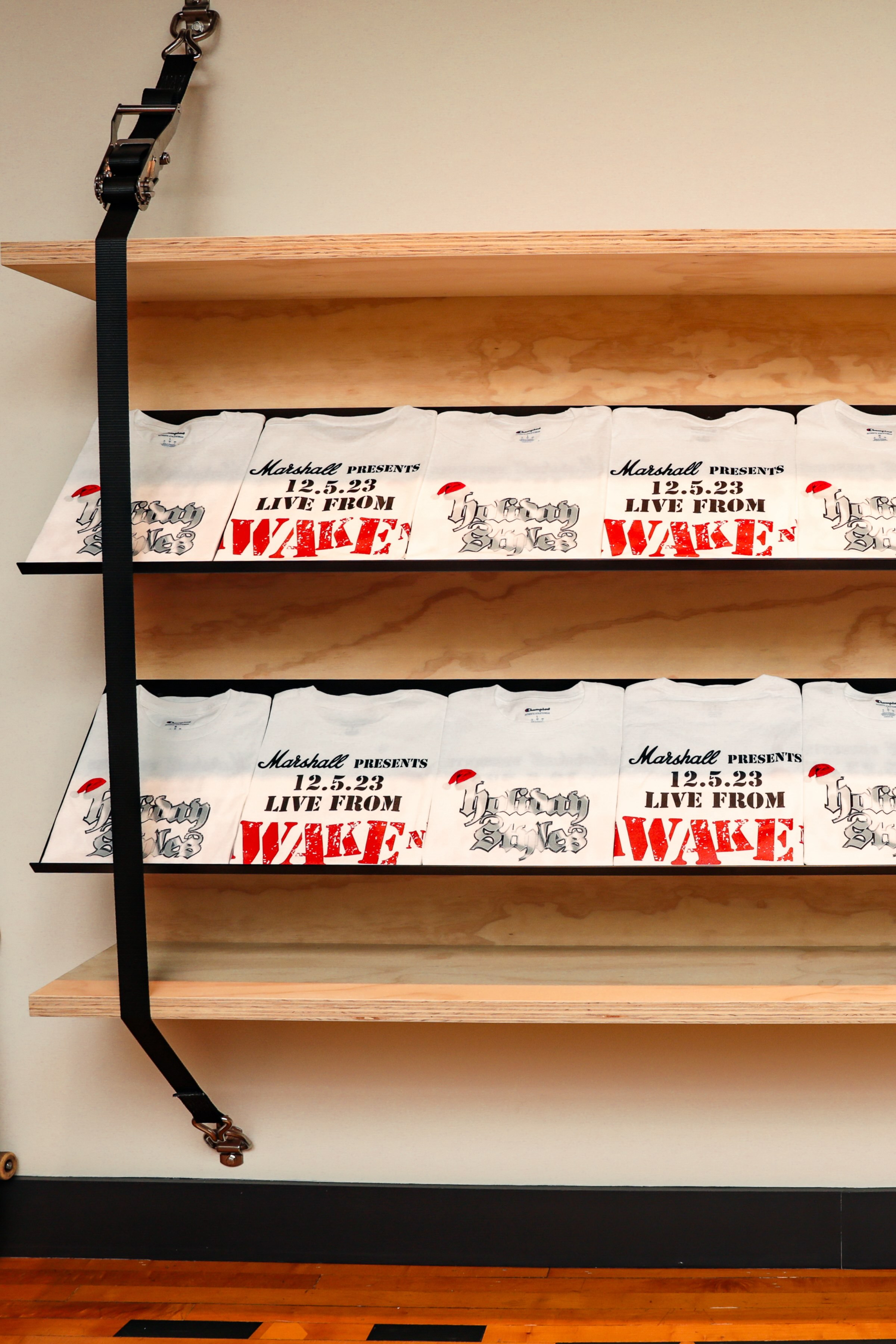 Marshall x Awake NY merch stacked on wooden shelves