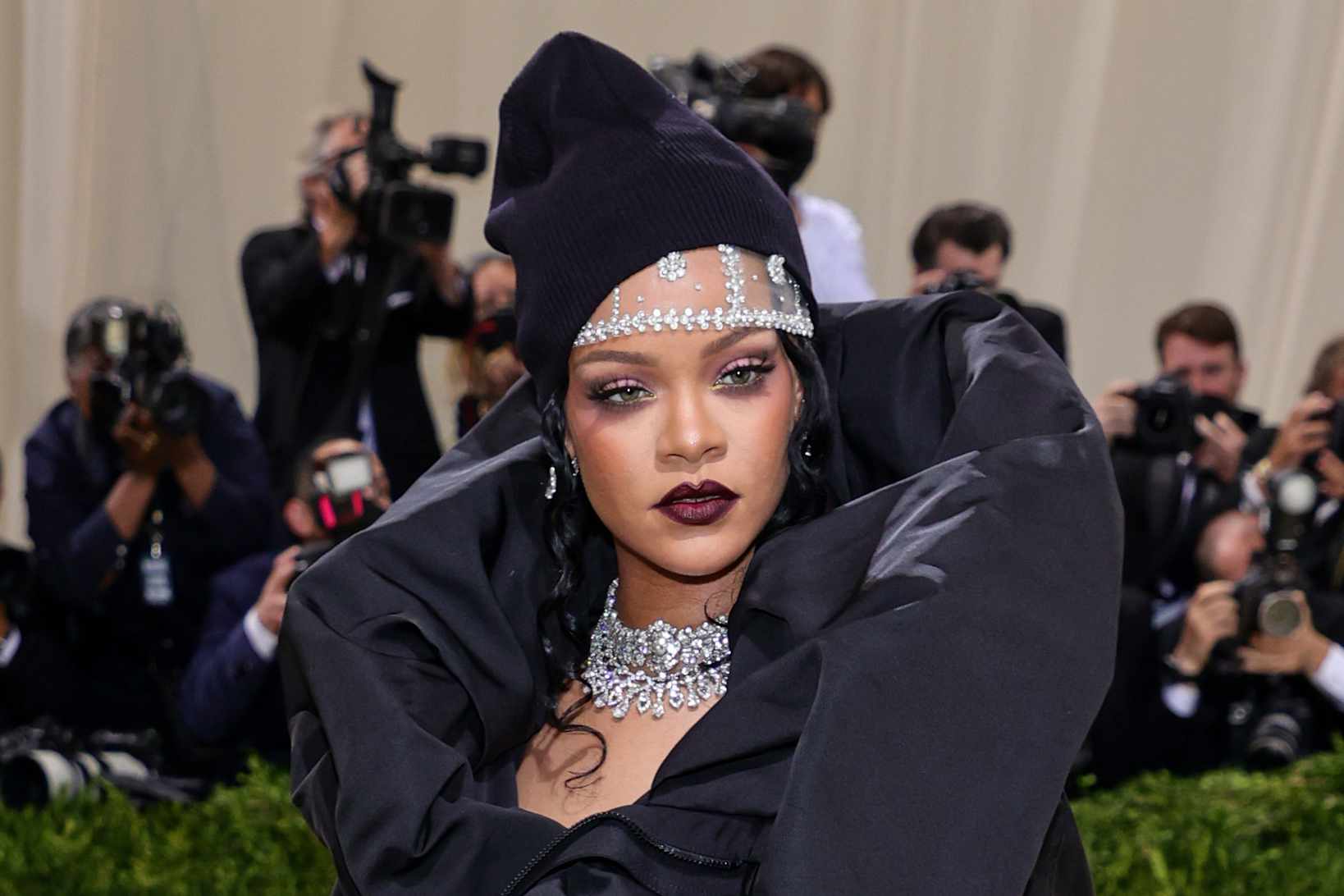 Rihanna wears a black dress and pearls at Met Gala 2022