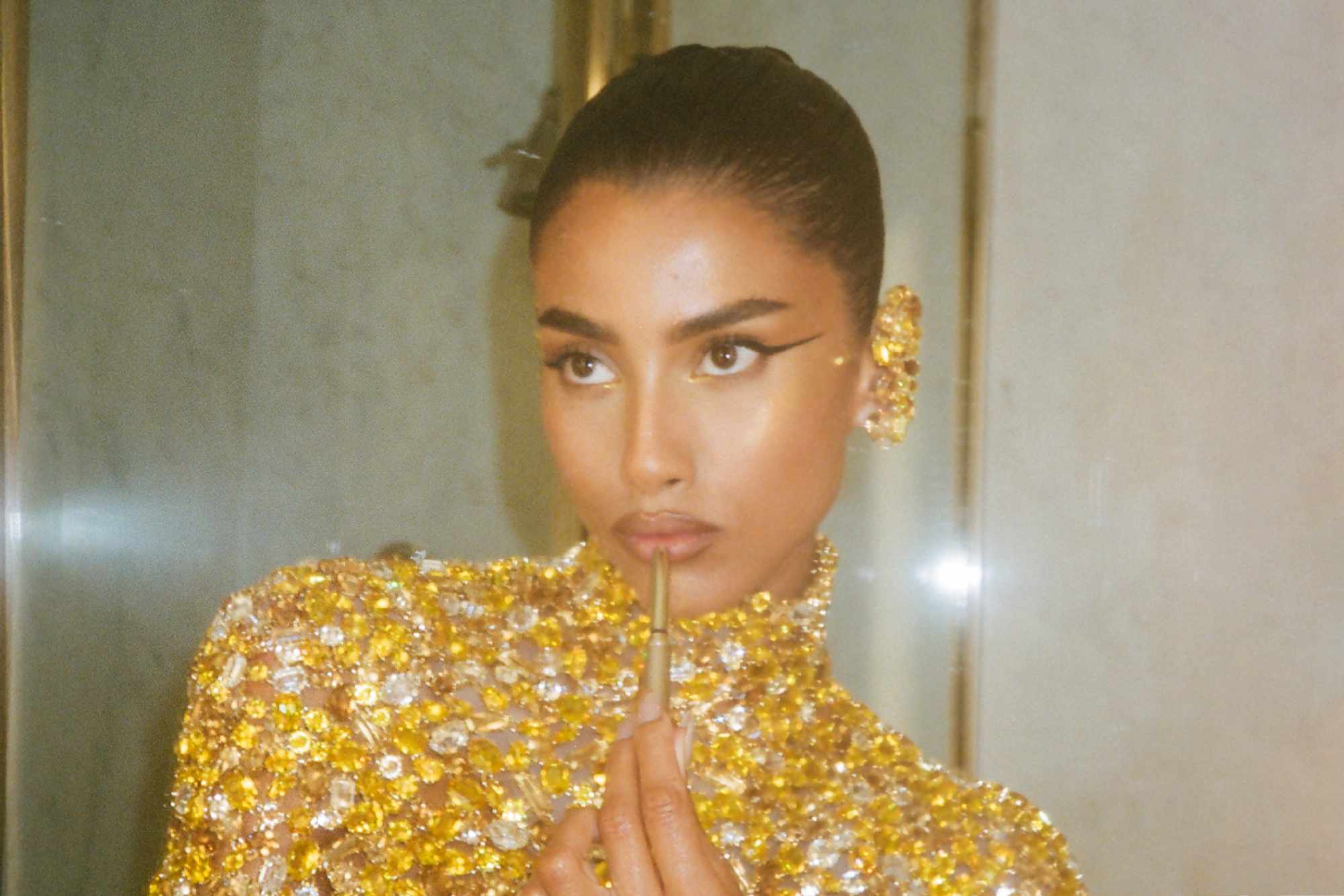 Imaan Hammam wears gold Swarovski crystals at the 2024 Met Gala