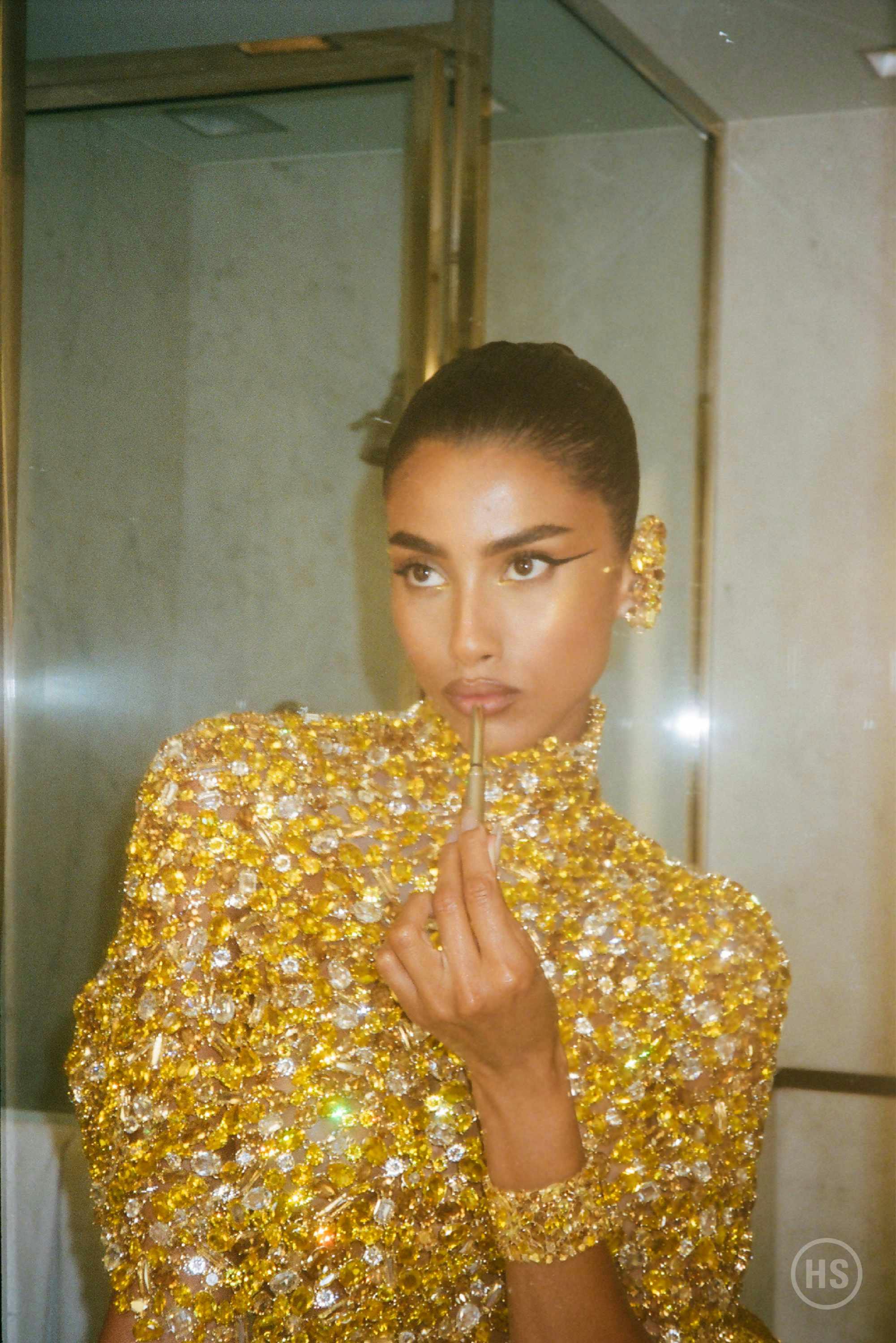 Imaan Hammam wears gold Swarovski crystals at the 2024 Met Gala