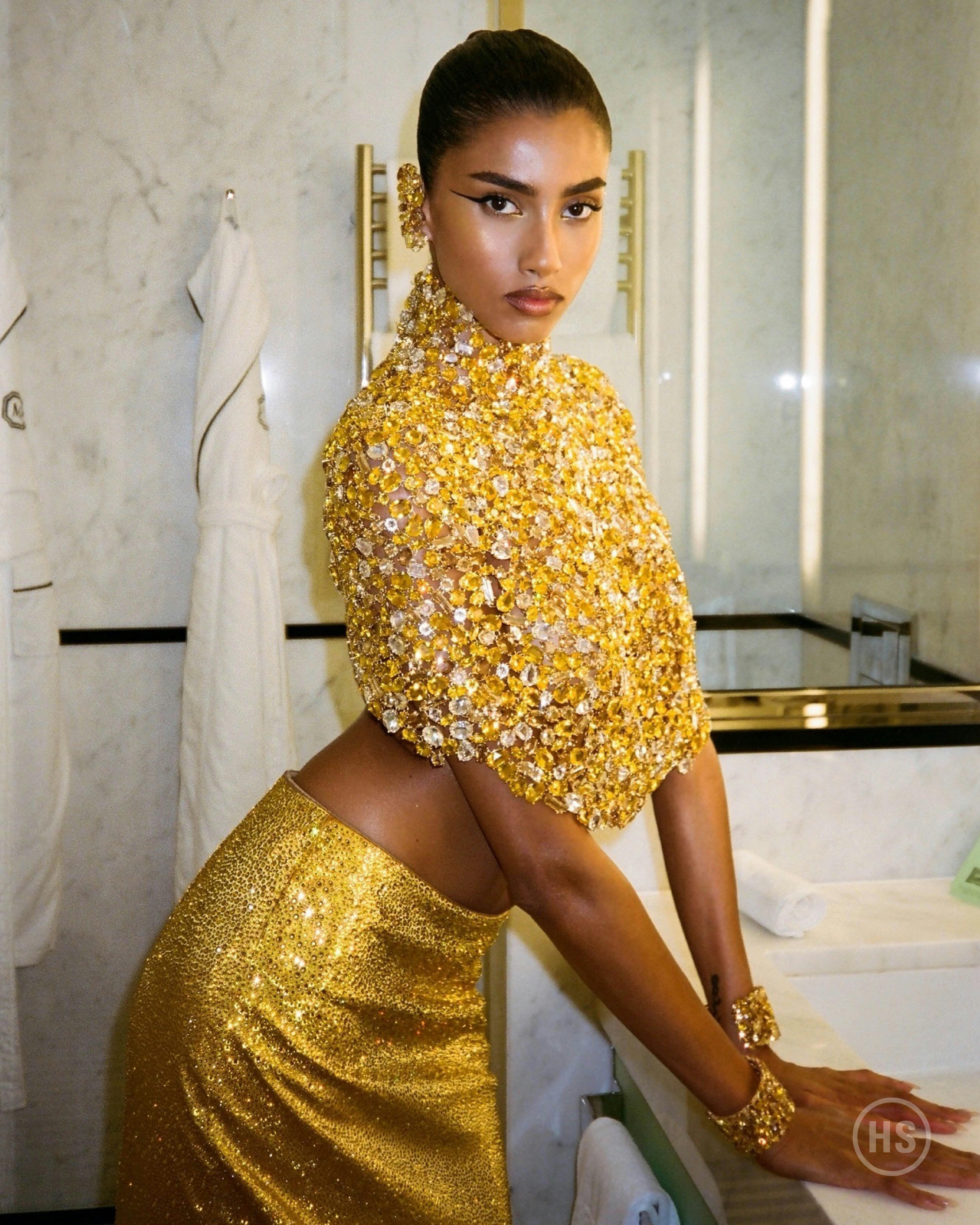 Imaan Hammam wears gold Swarovski crystals at the 2024 Met Gala