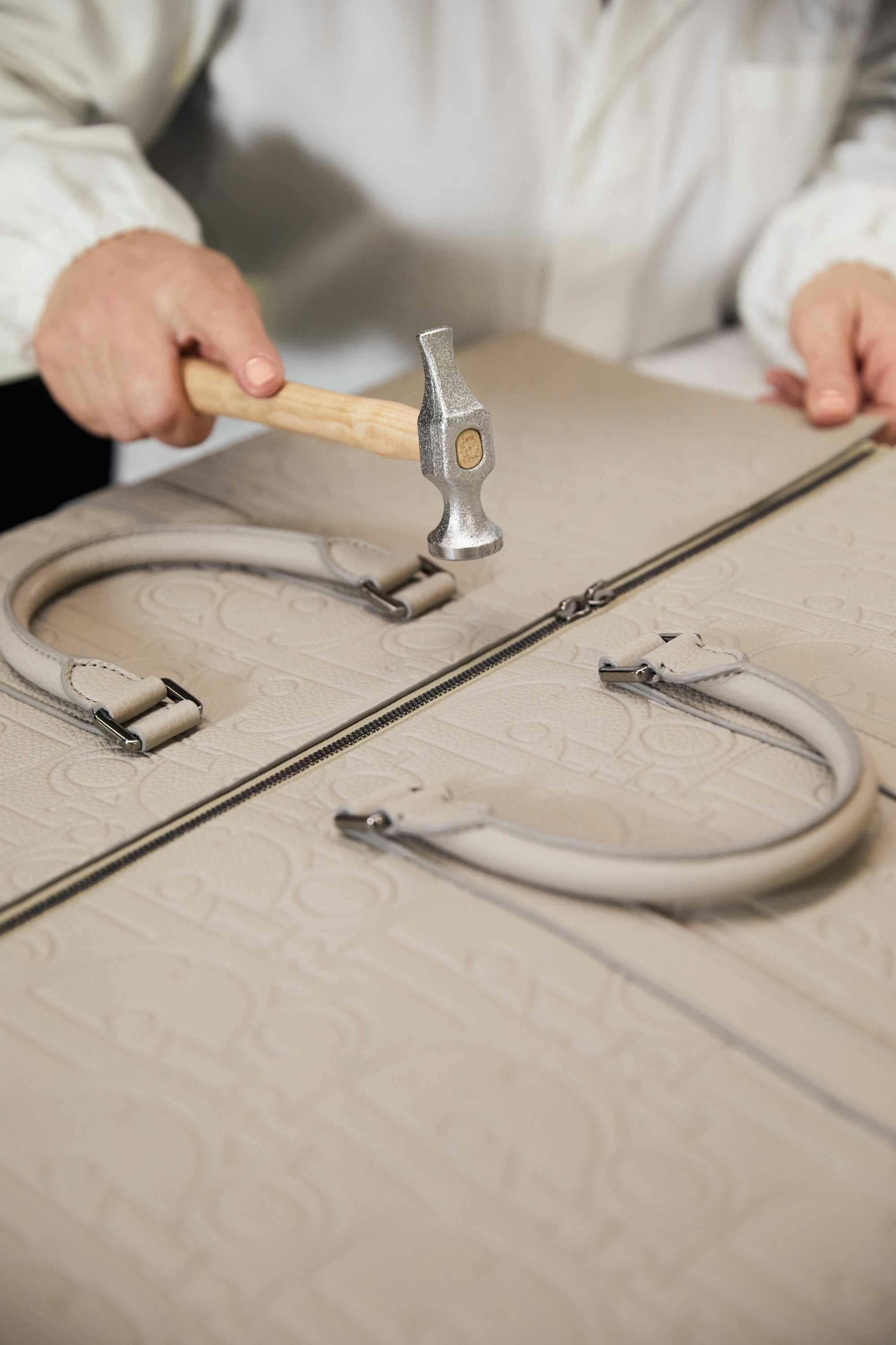 Dior's leather Gravity bags in beige and black made at an Italian factory