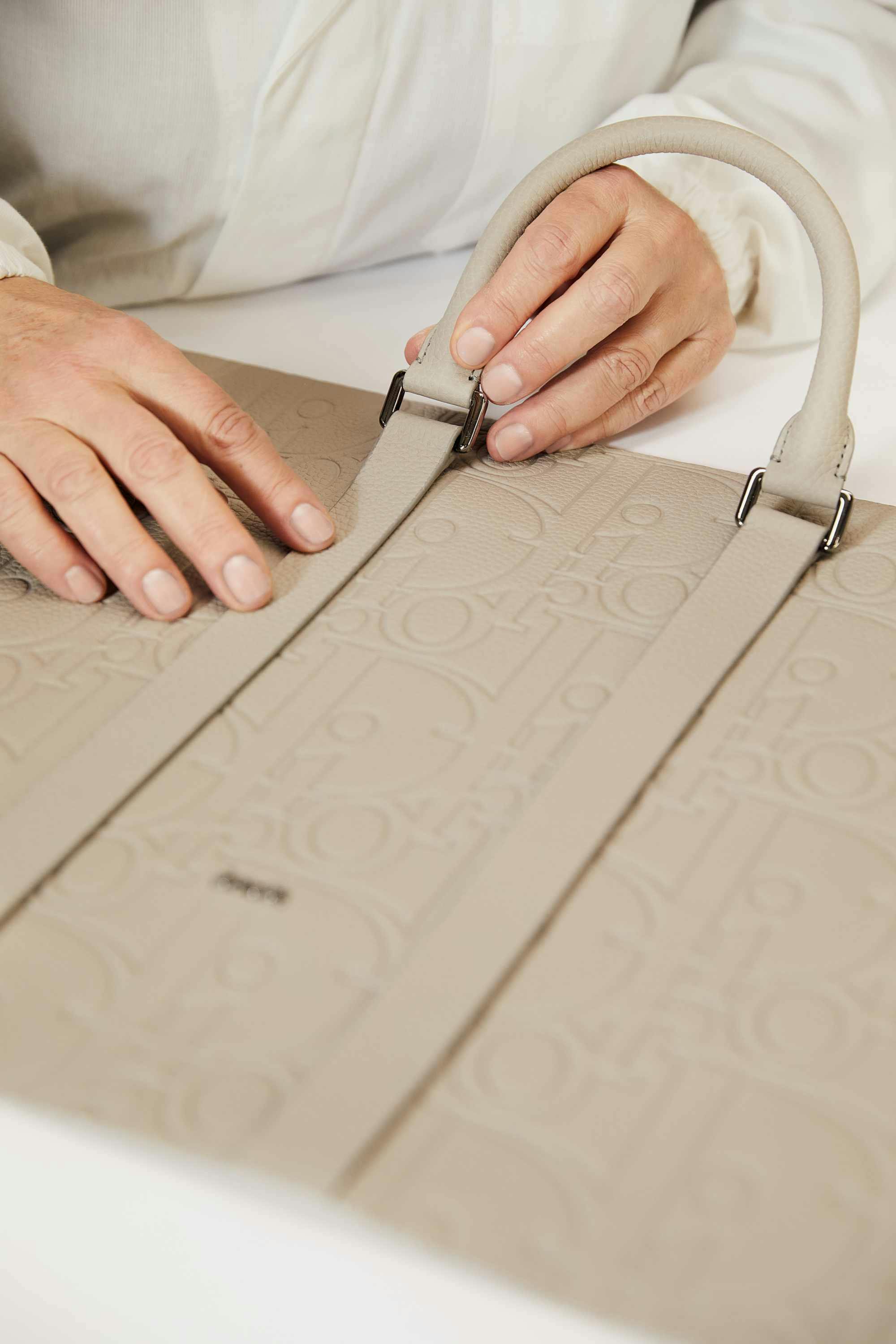 Dior's leather Gravity bags in beige and black made at an Italian factory