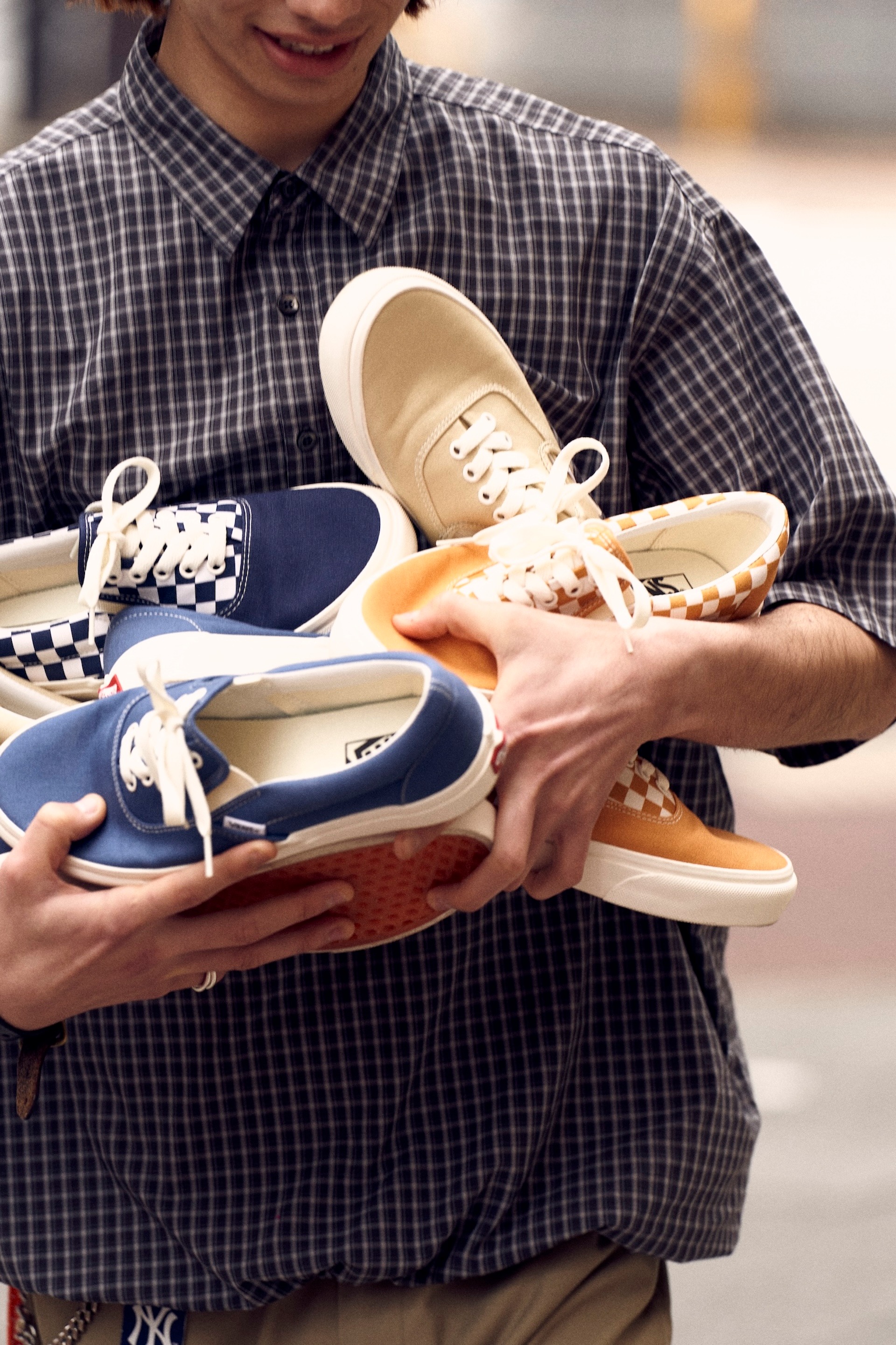Vans' Erap sneaker that combines the Era and Slip-On sneakers in blue, black, and yellow checkerboard