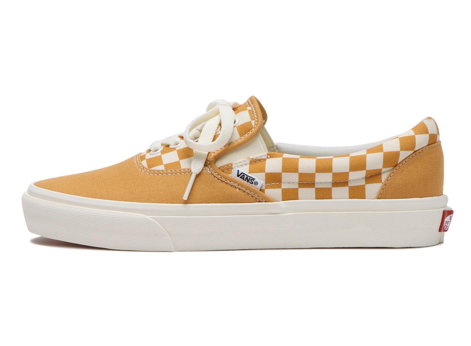 Vans' Erap sneaker that combines the Era and Slip-On sneakers in blue, black, and yellow checkerboard