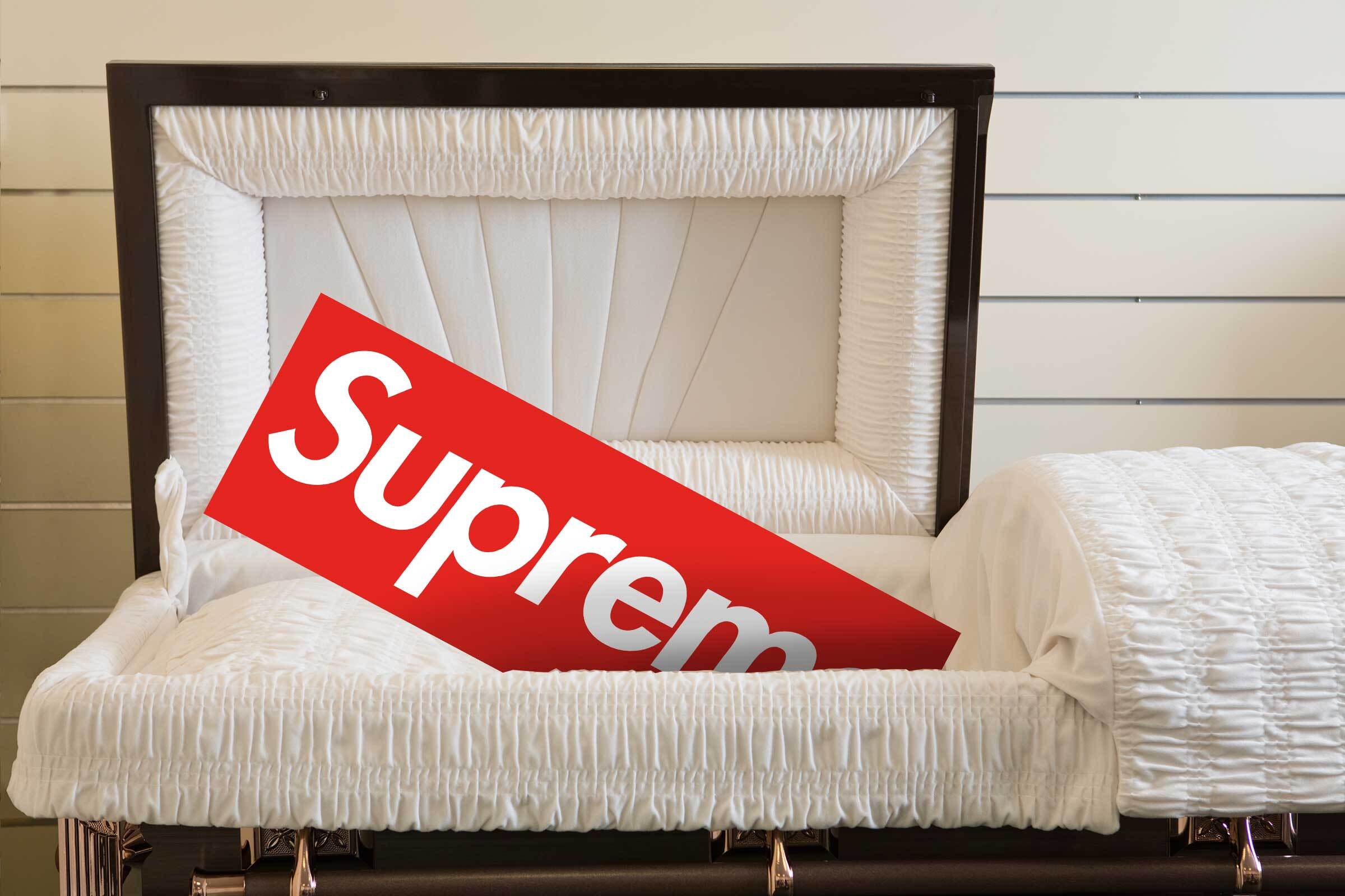 Supreme's red sticker box logo seen in a coffin