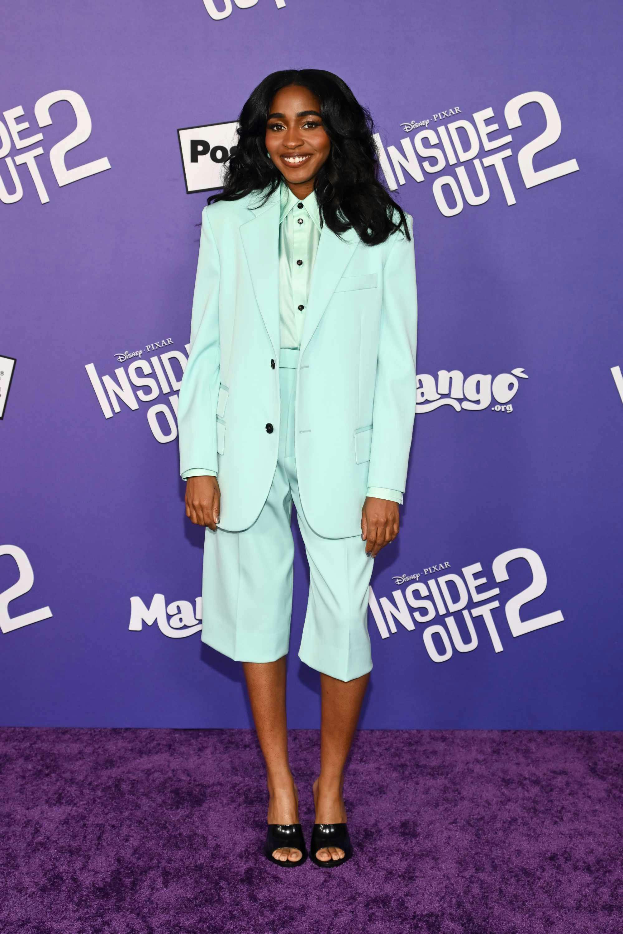 Ayo Edebiri wearing a white Bottega Veneta shorts suit