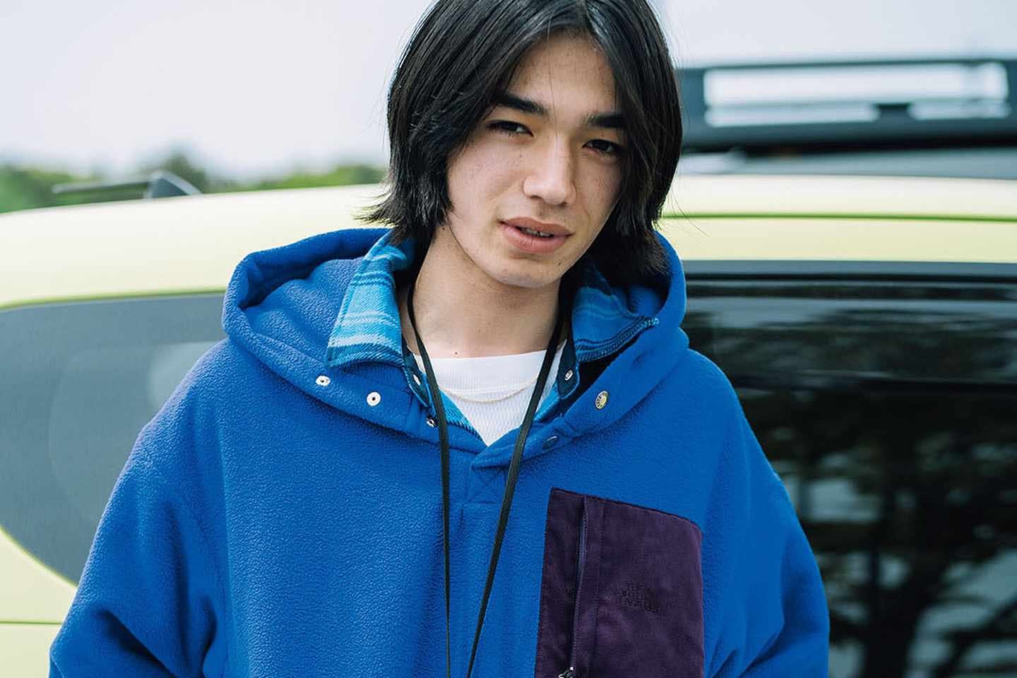 The North Face Purple Label's Fall/Winter 2024 lookbook, with a model wearing a blue zip-up fleece jacket and white T-shirt
