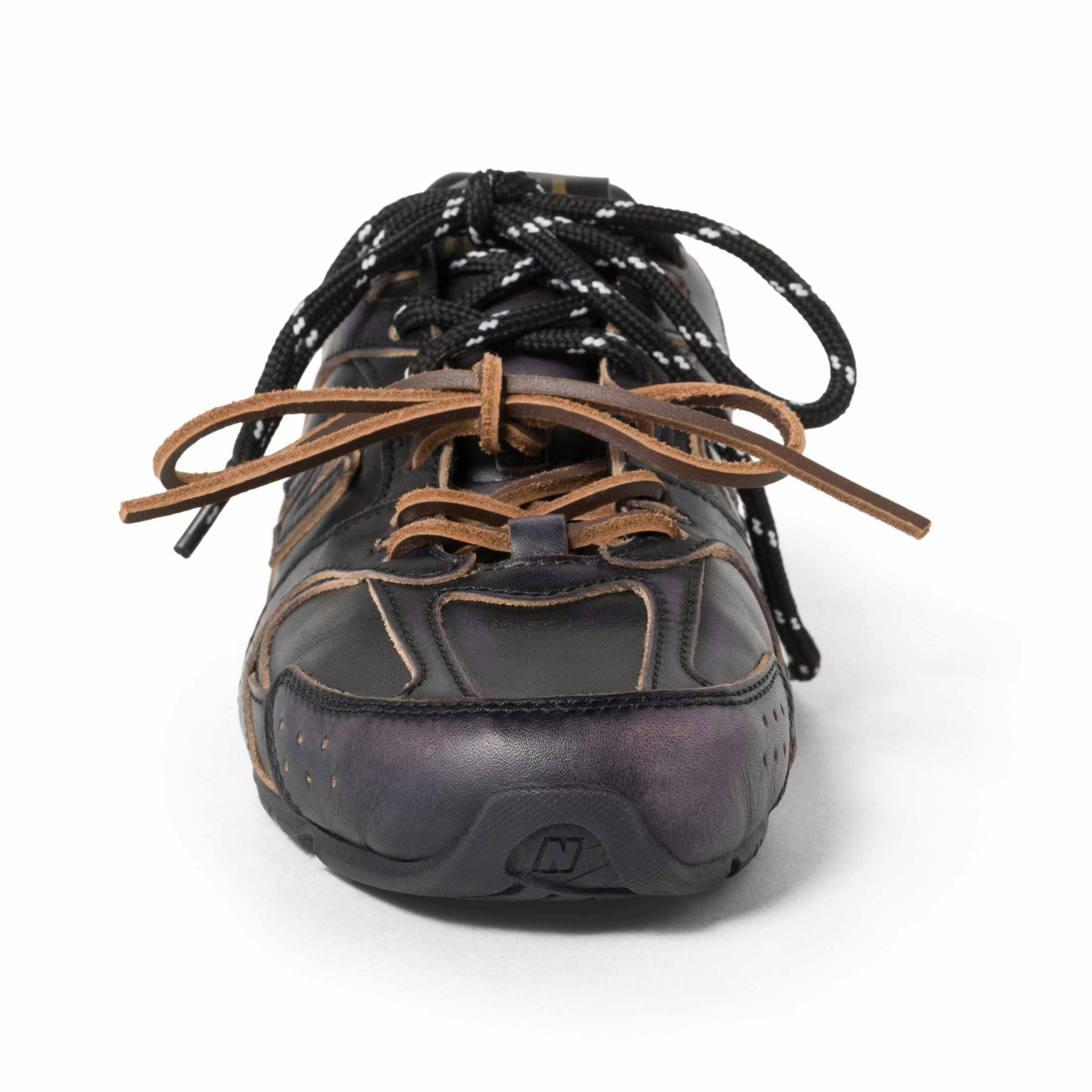Miu Miu's New Balance 530 sneaker collab in black and white leather with two laces