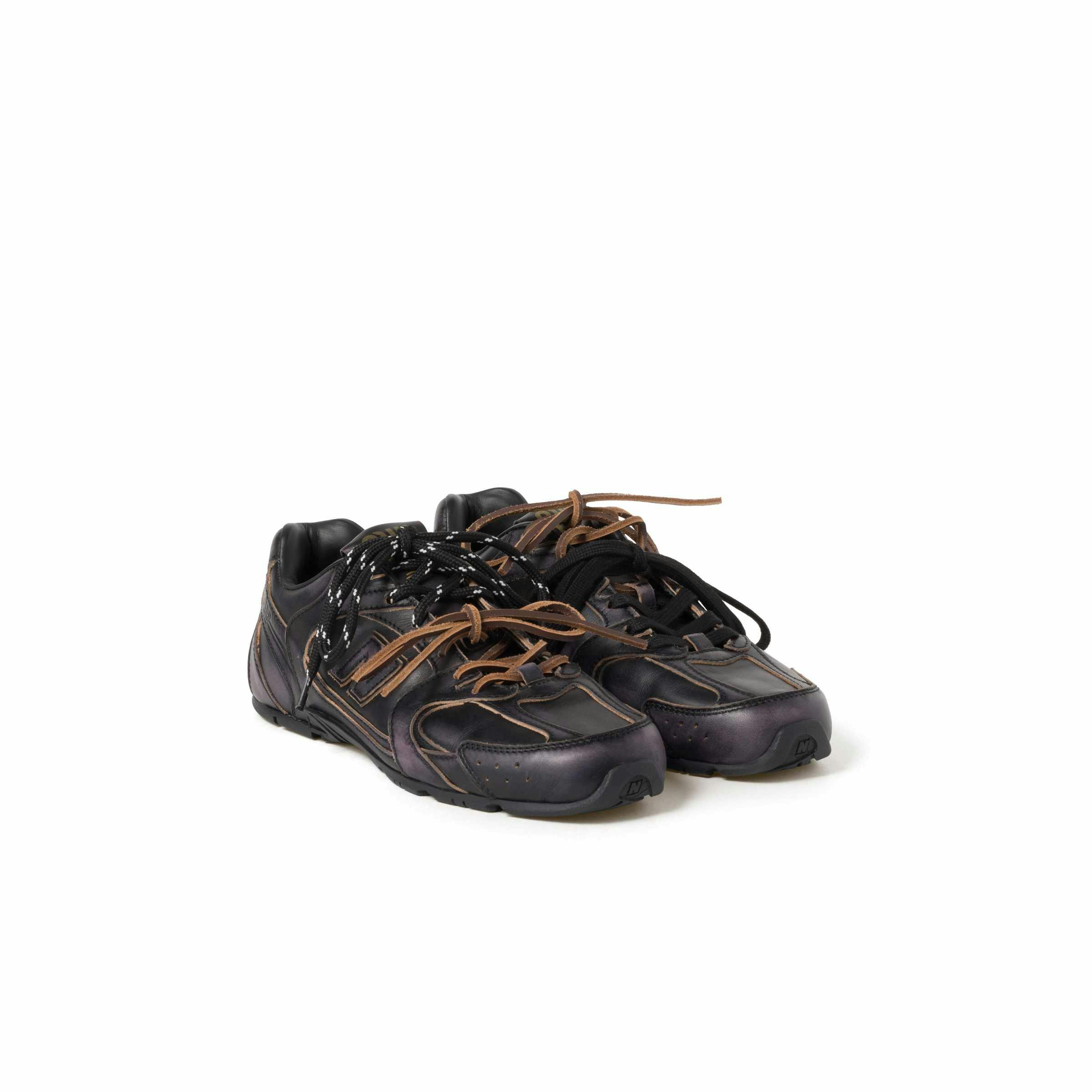 Miu Miu's New Balance 530 sneaker collab in black and white leather with two laces