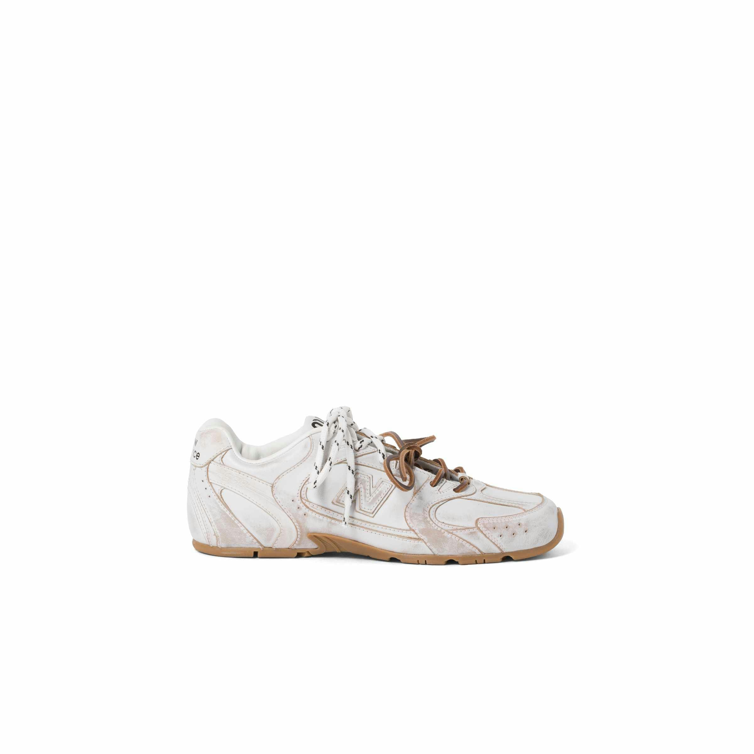 Miu Miu's New Balance 530 sneaker collab in black and white leather with two laces
