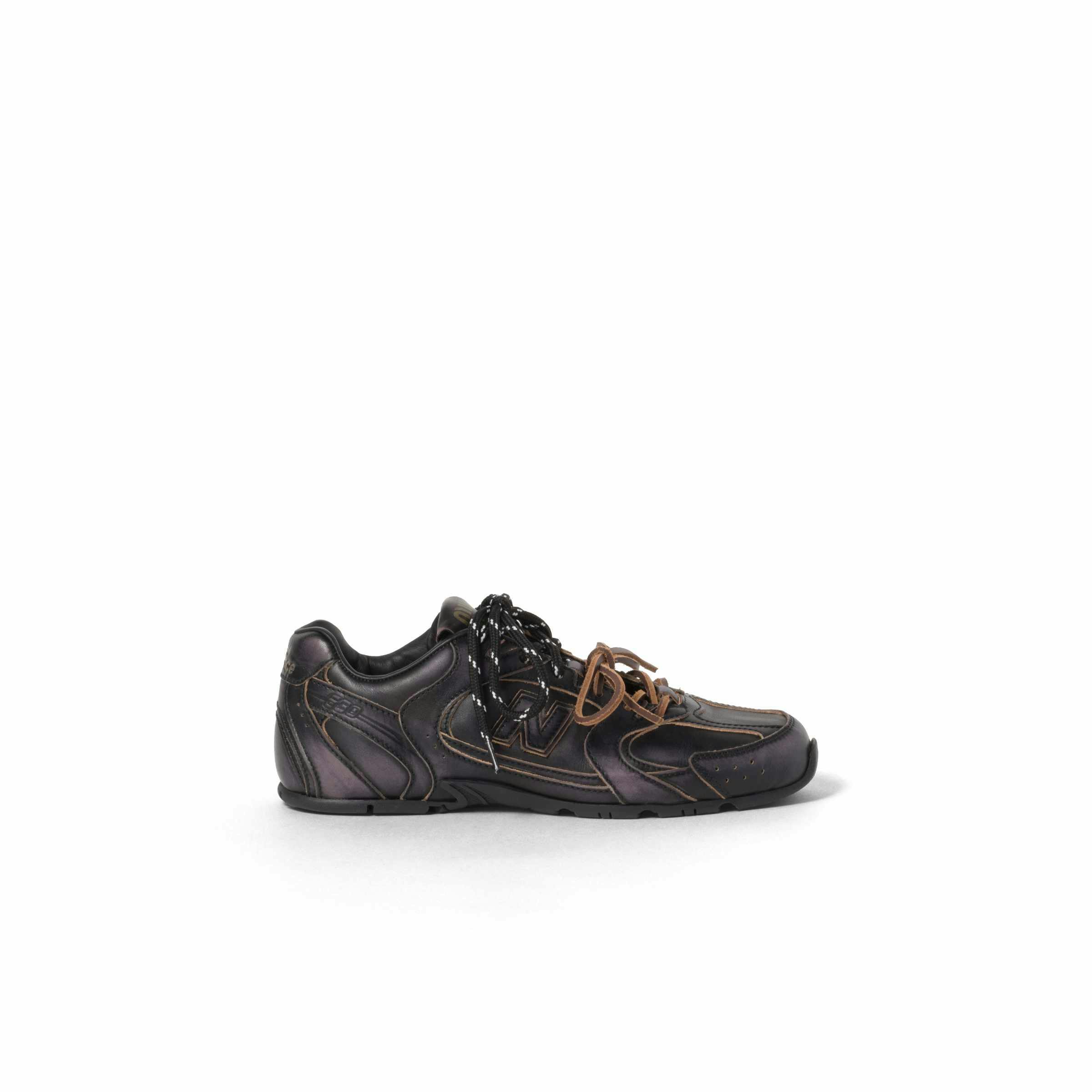 Miu Miu's New Balance 530 sneaker collab in black and white leather with two laces