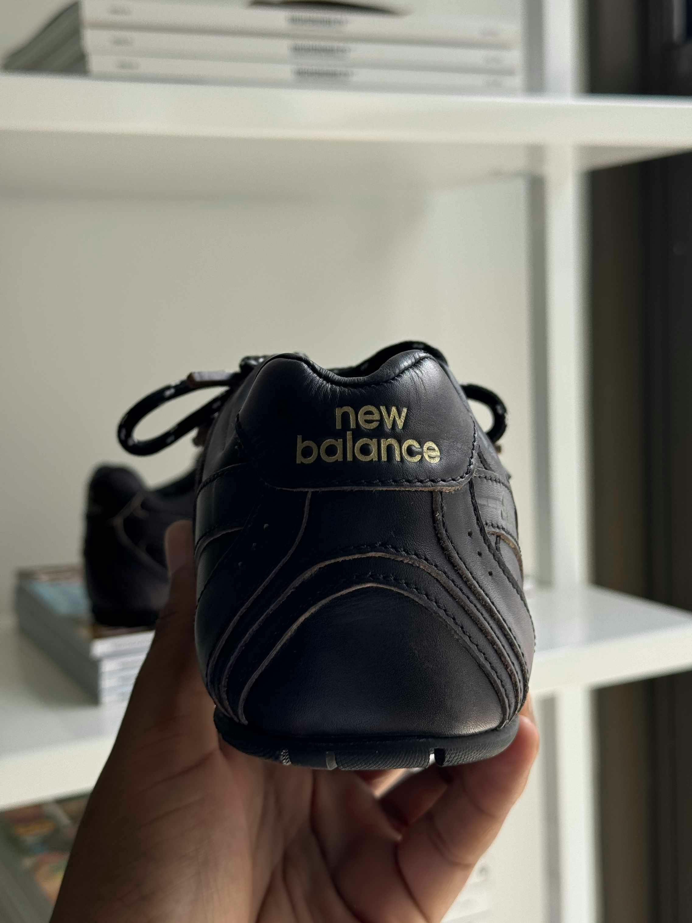 Miu Miu's New Balance 530 sneaker collab in black leather with two laces