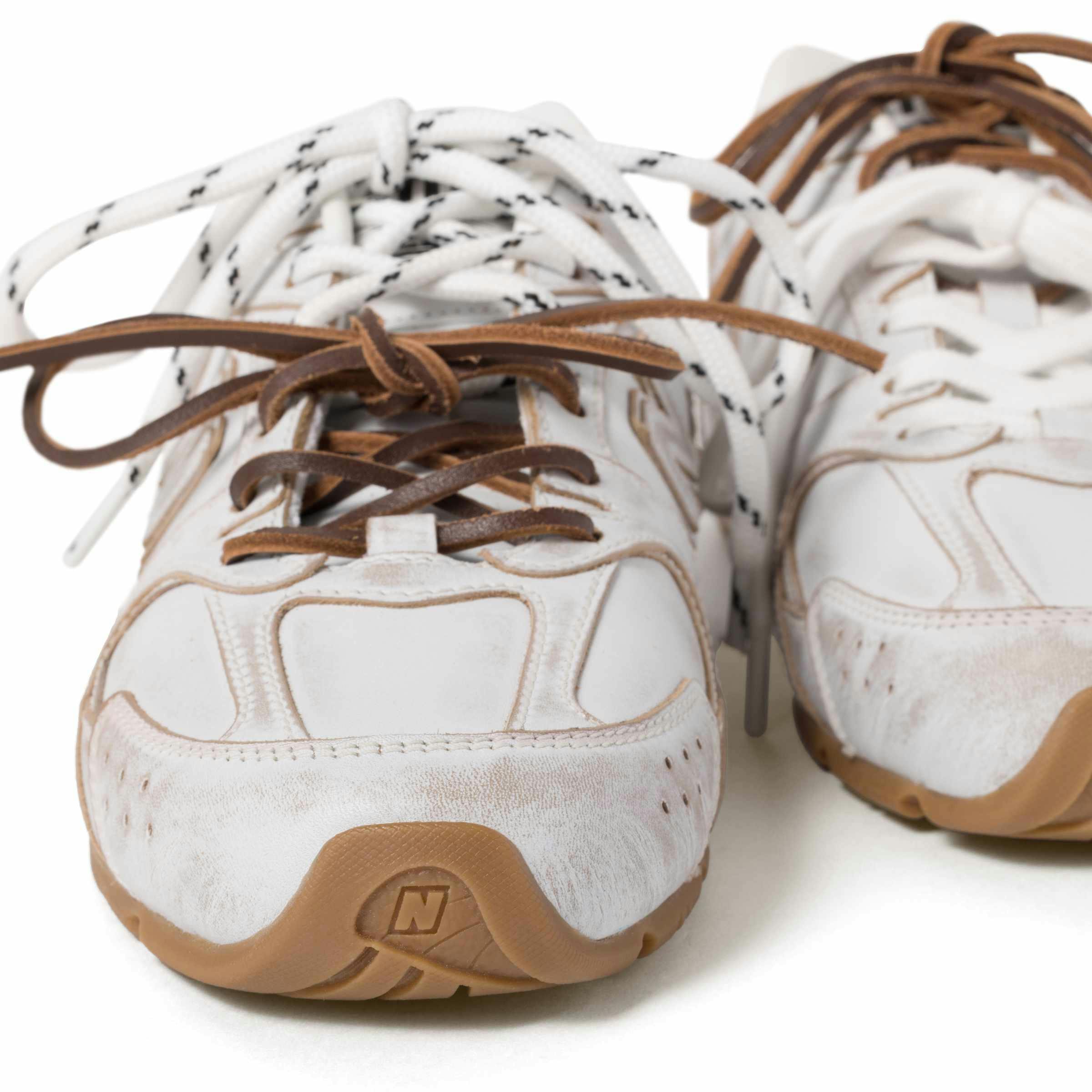 Miu Miu's New Balance 530 sneaker collab in black and white leather with two laces