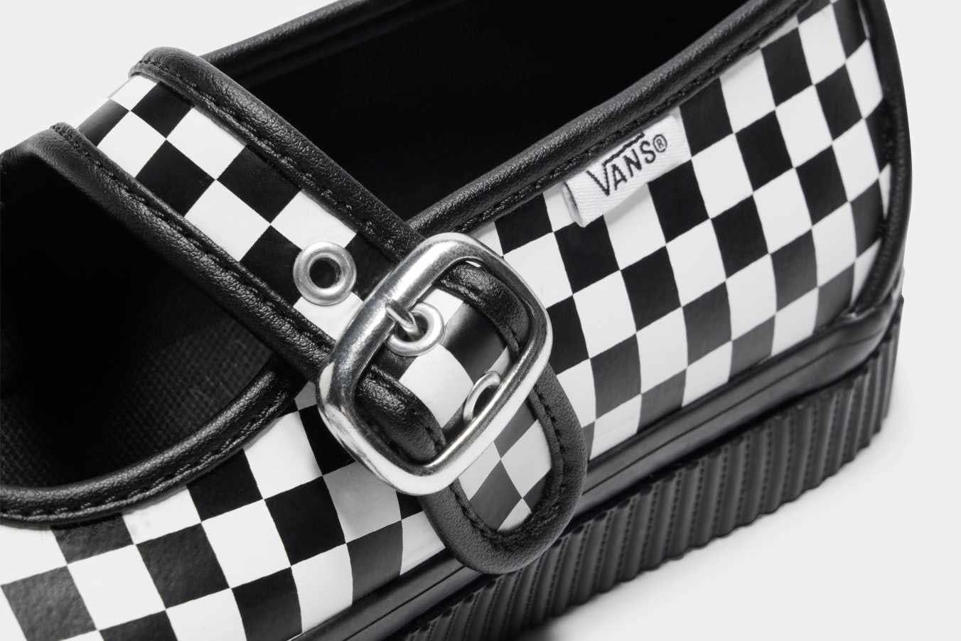 Vans' checkerboard mary jane style 93 skate sneaker with a black leather lining and silver buckle