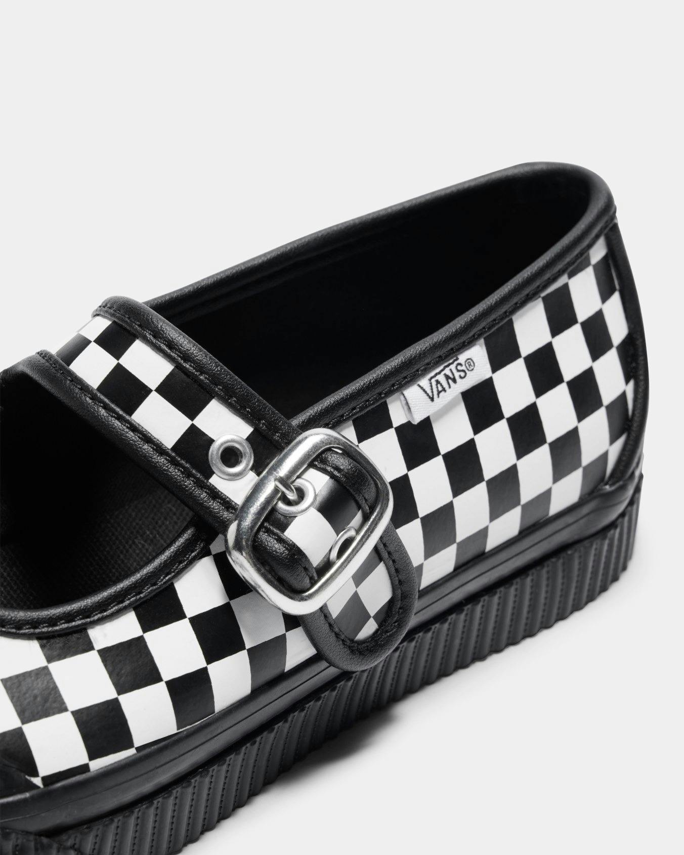 Vans' checkerboard mary jane style 93 skate sneaker with a black leather lining and silver buckle