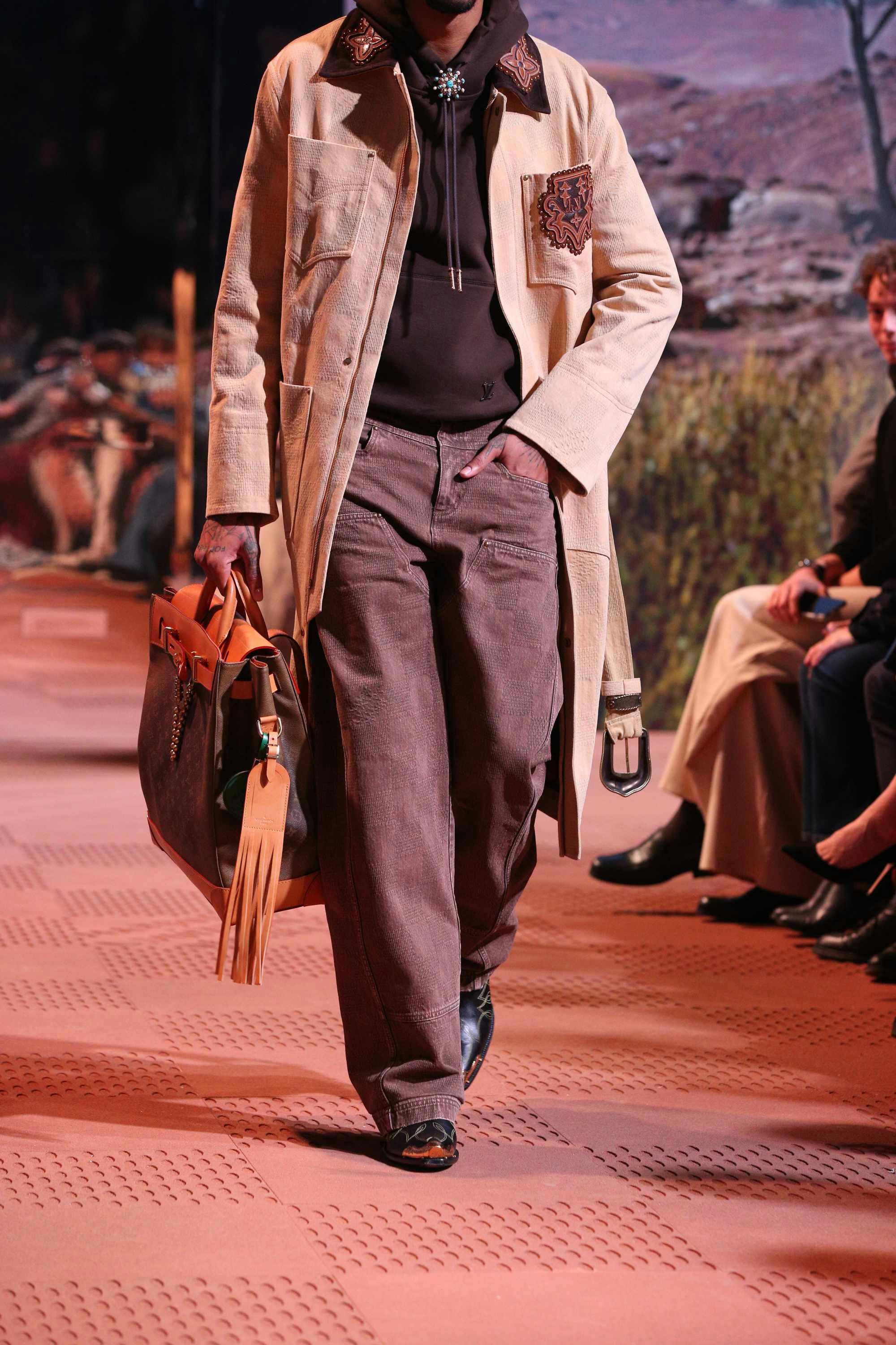Louis Vuitton's Timberland boot collab revealed by Pharrell Williams, including beige and black 6" leather boots and ranger-style pull ons in Louis Vuitton-monogrammed boxes