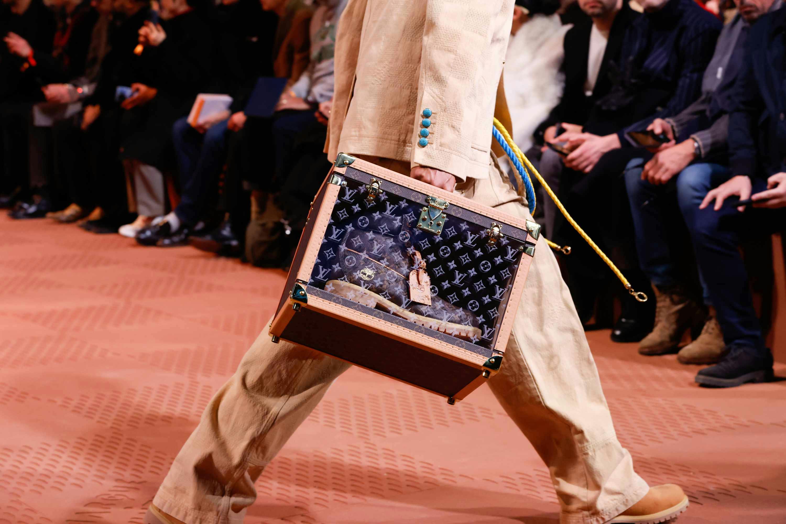 Louis Vuitton's Timberland boot collab revealed by Pharrell Williams, including beige and black 6" leather boots and ranger-style pull ons in Louis Vuitton-monogrammed boxes