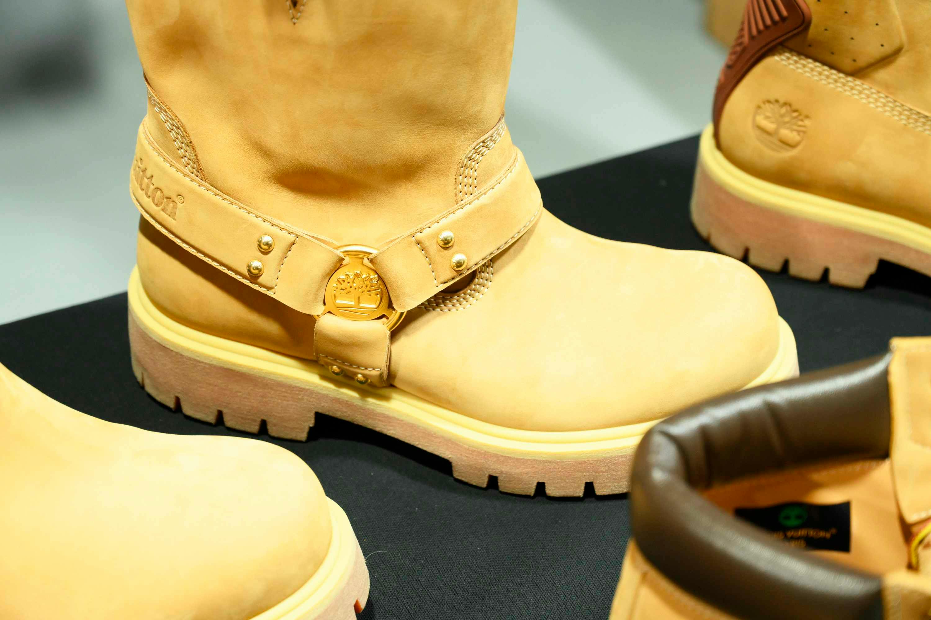 Louis Vuitton's Timberland boot collab revealed by Pharrell Williams, including beige and black 6" leather boots and ranger-style pull ons in Louis Vuitton-monogrammed boxes