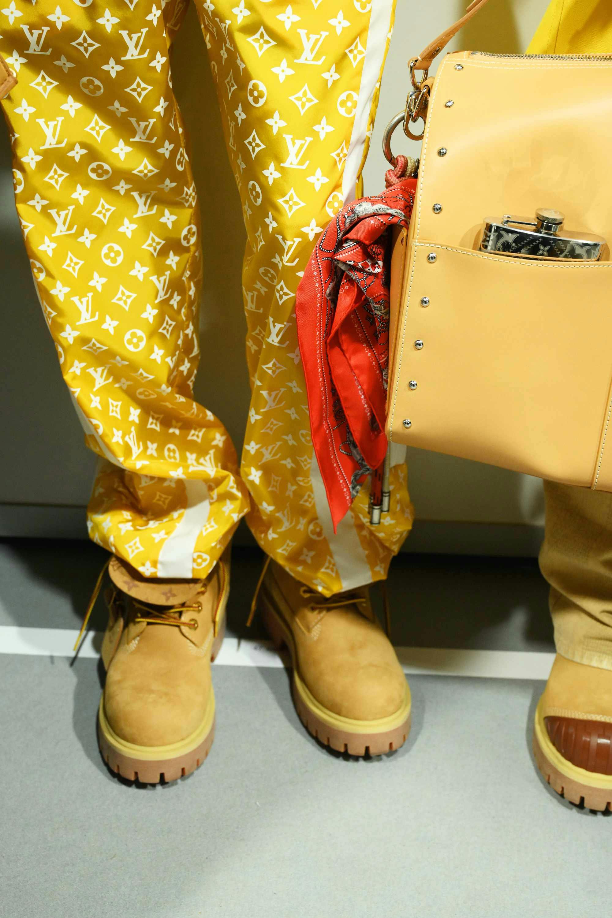 Louis Vuitton's Timberland boot collab revealed by Pharrell Williams, including beige and black 6" leather boots and ranger-style pull ons in Louis Vuitton-monogrammed boxes
