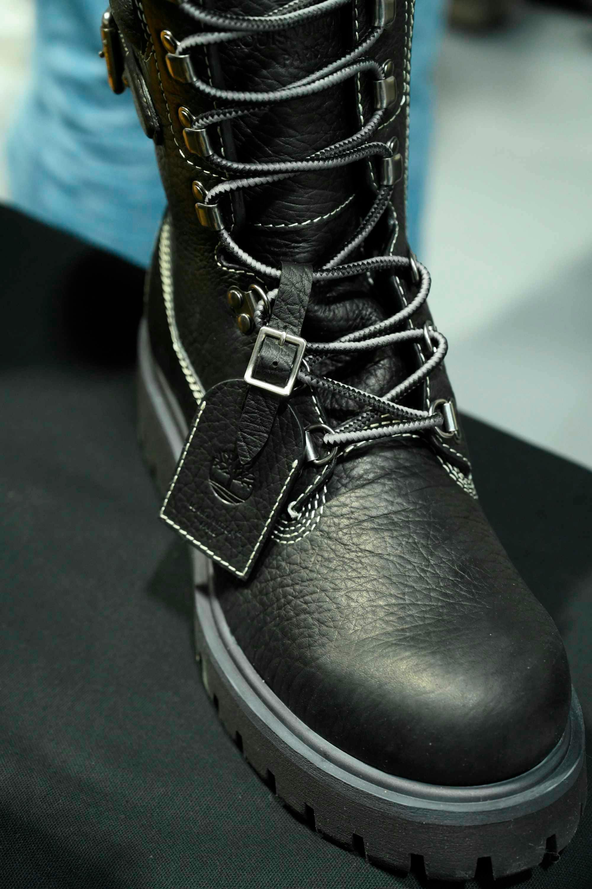 Louis Vuitton's Timberland boot collab revealed by Pharrell Williams, including beige and black 6" leather boots and ranger-style pull ons in Louis Vuitton-monogrammed boxes