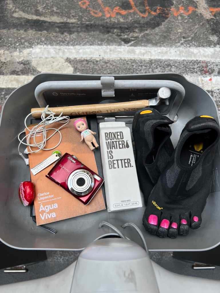 Citibike baskets accessorized with magazines, shoes, sunglasses