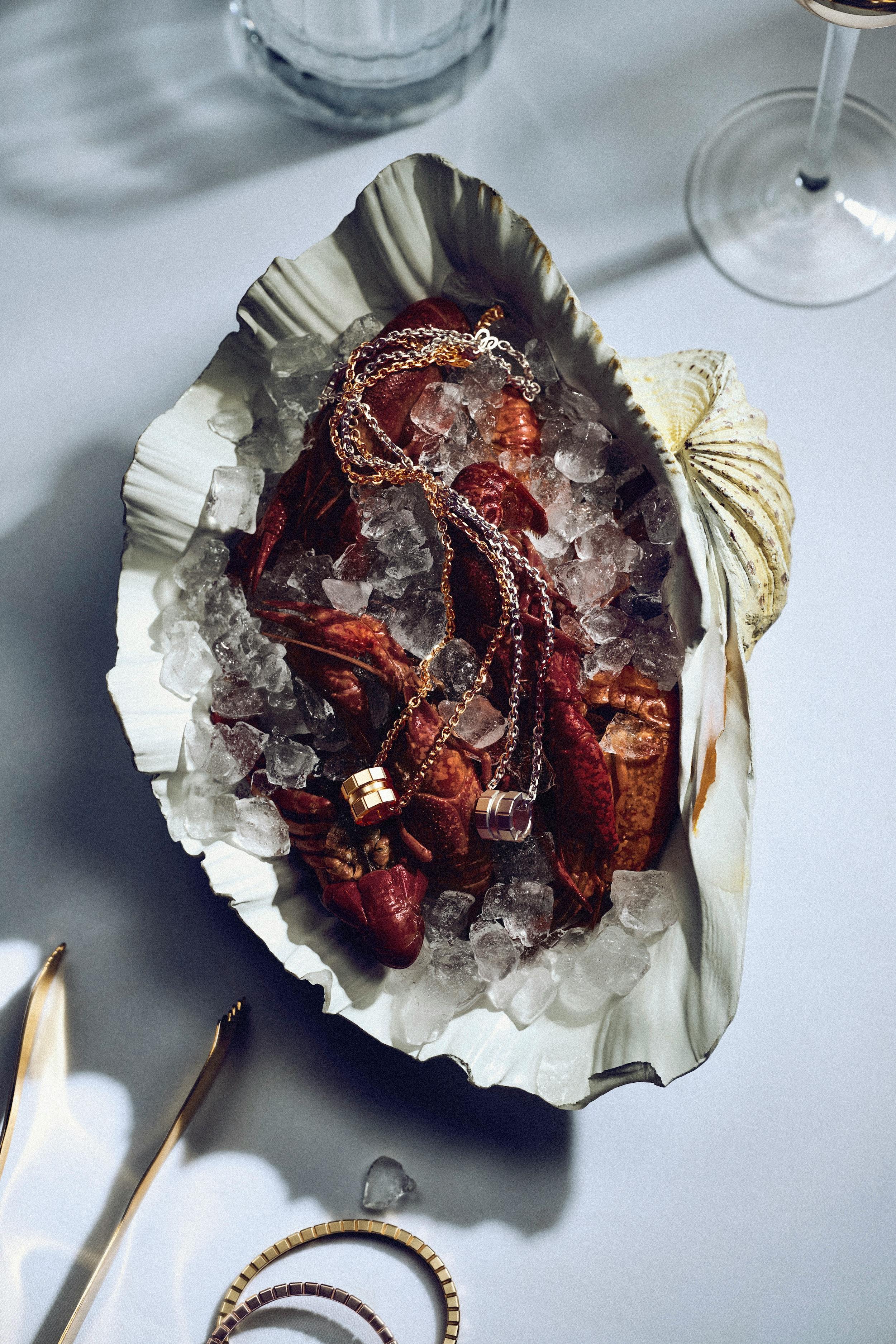 Chopard Ice Cube Collection photographed with a luxurious spread of seafood