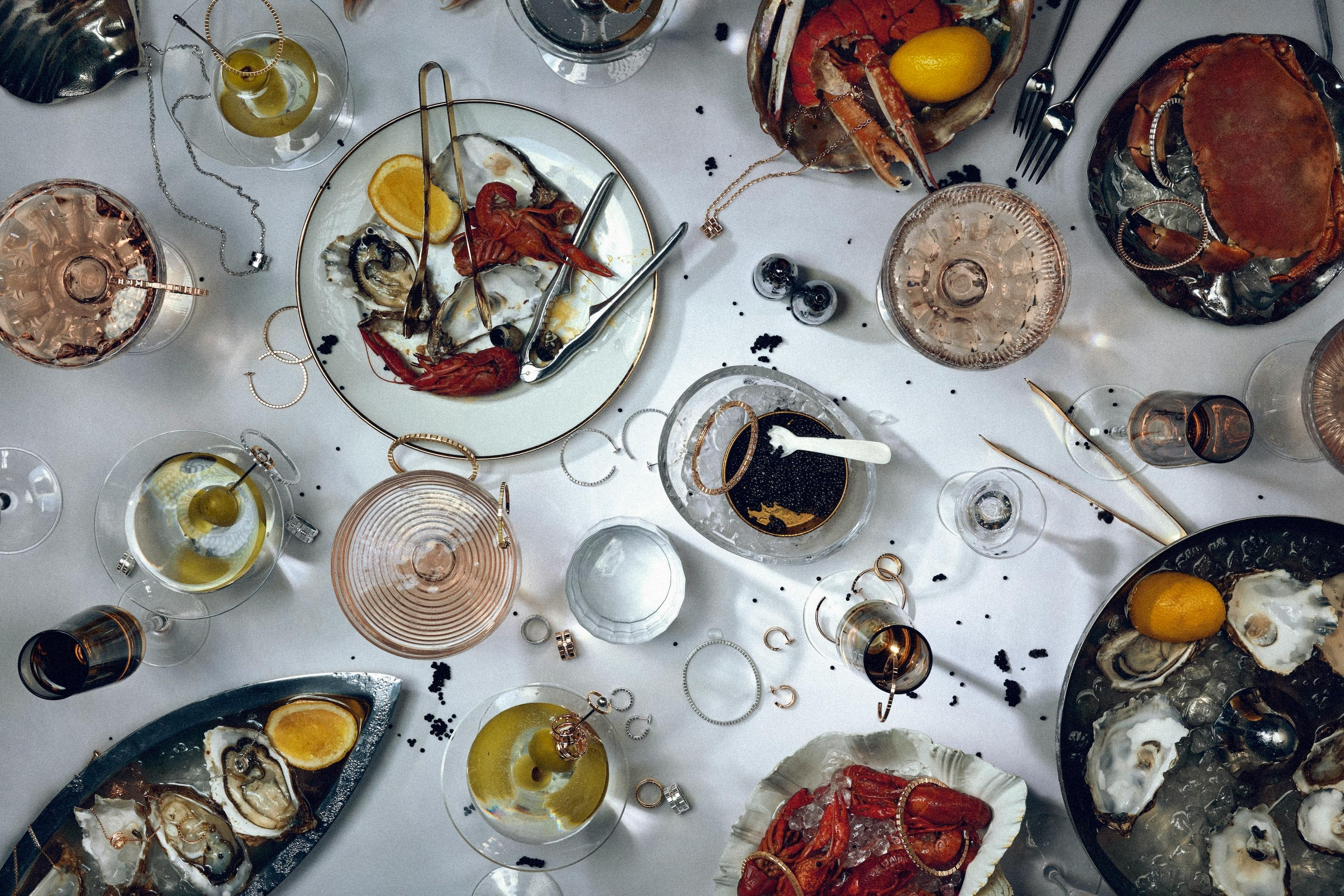 Chopard Ice Cube Collection photographed with a luxurious spread of seafood