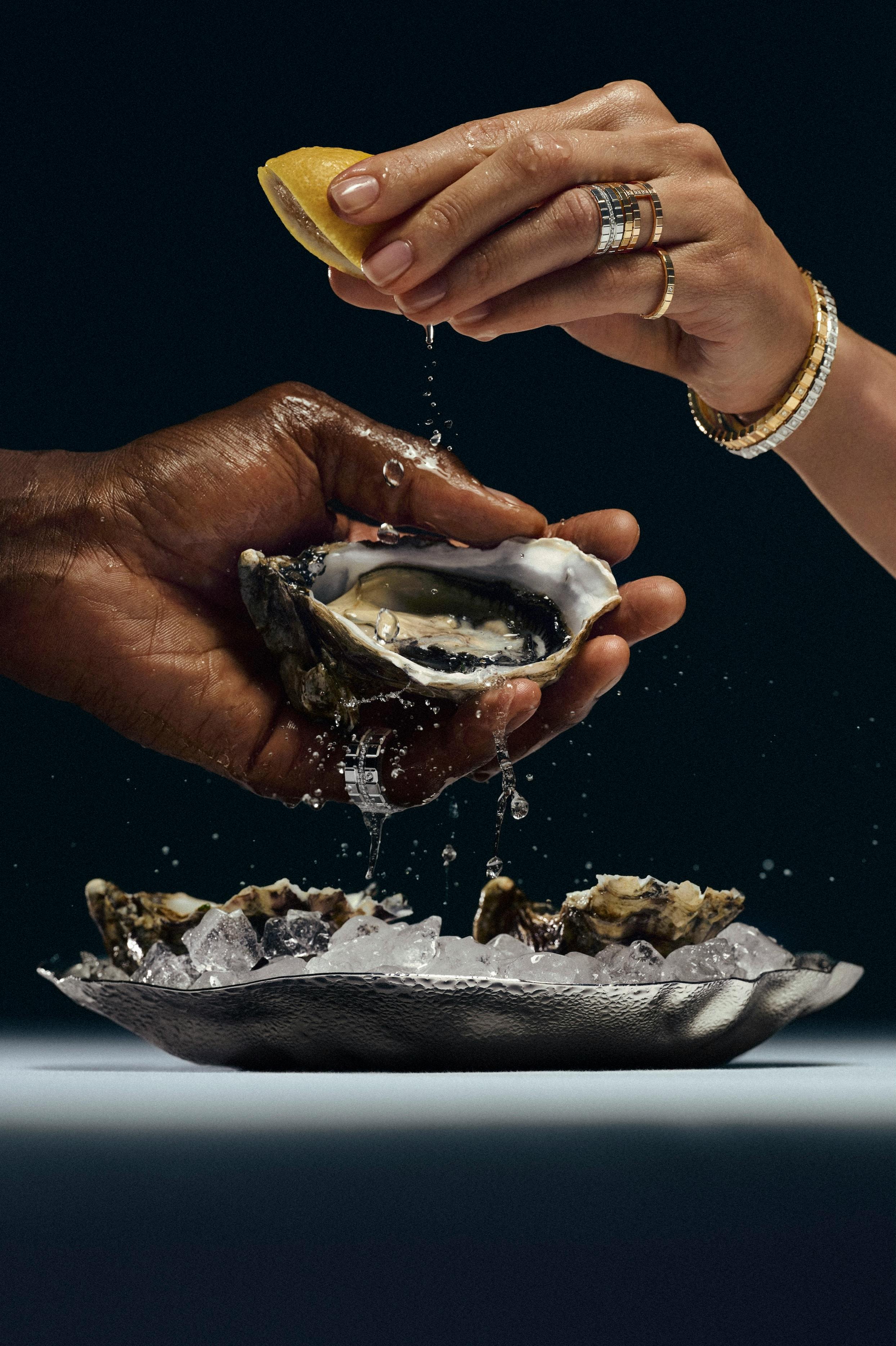 Chopard Ice Cube Collection photographed with a luxurious spread of seafood