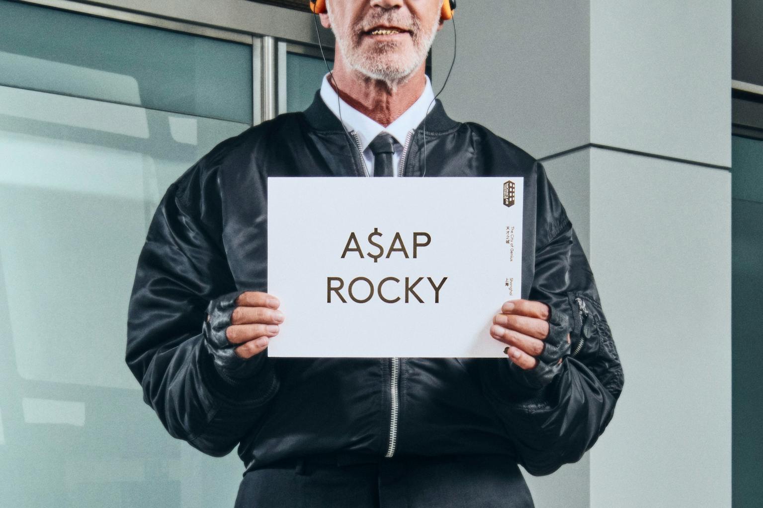 Moncler drivers holding name card with talent name to pick them up from airport