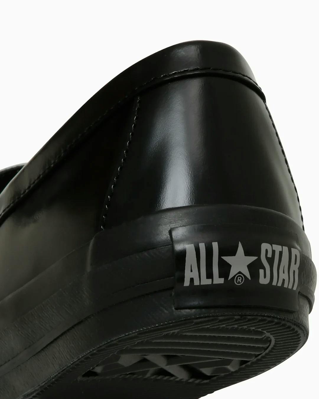 converse skate loafer penny slipon sneaker in black and white leather