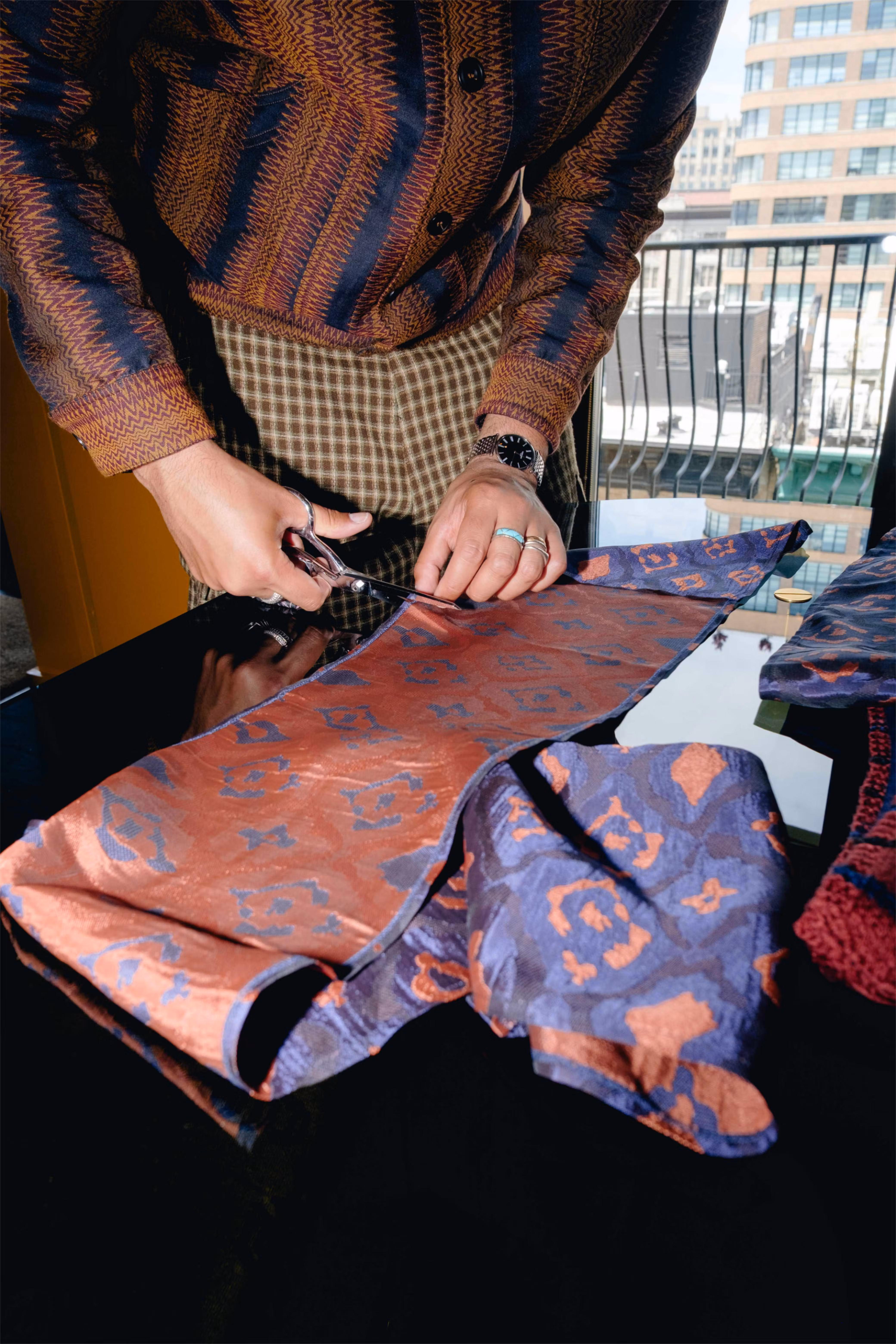 Designer Nicholas Daley alters a scarf for Leon Bridges' Met Gala look