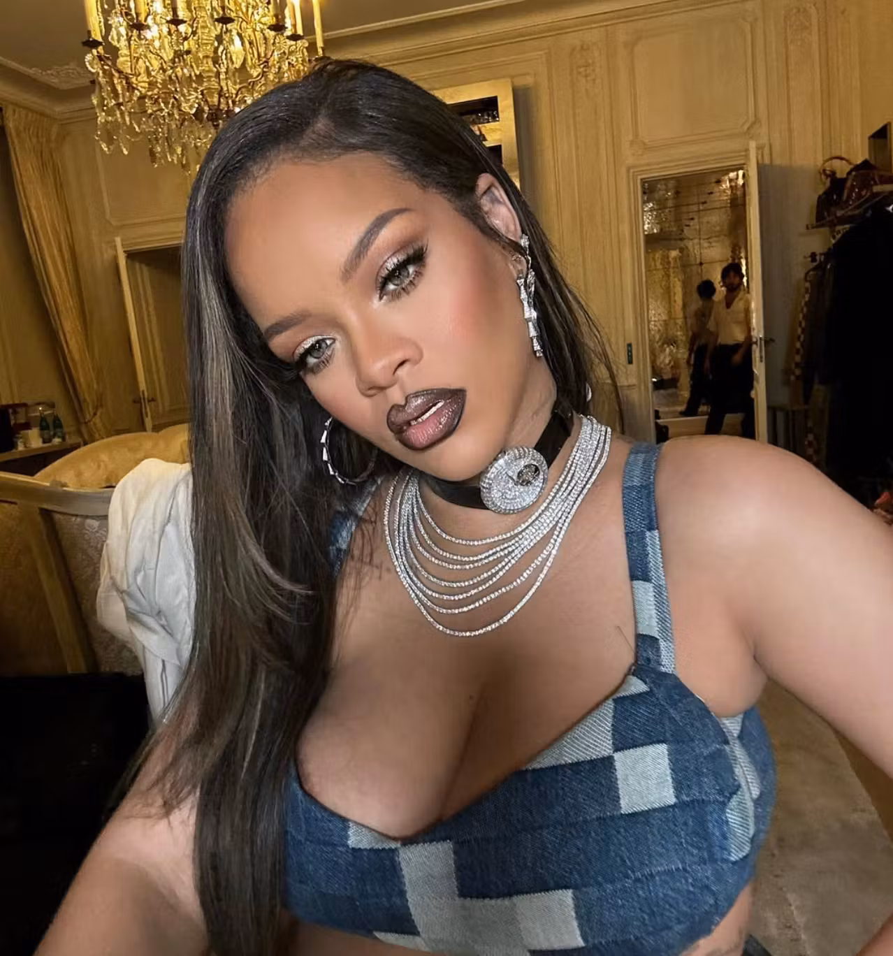 Jacob & Co. watch choker around her neck at a Louis Vuitton fashion show, back in 2023.