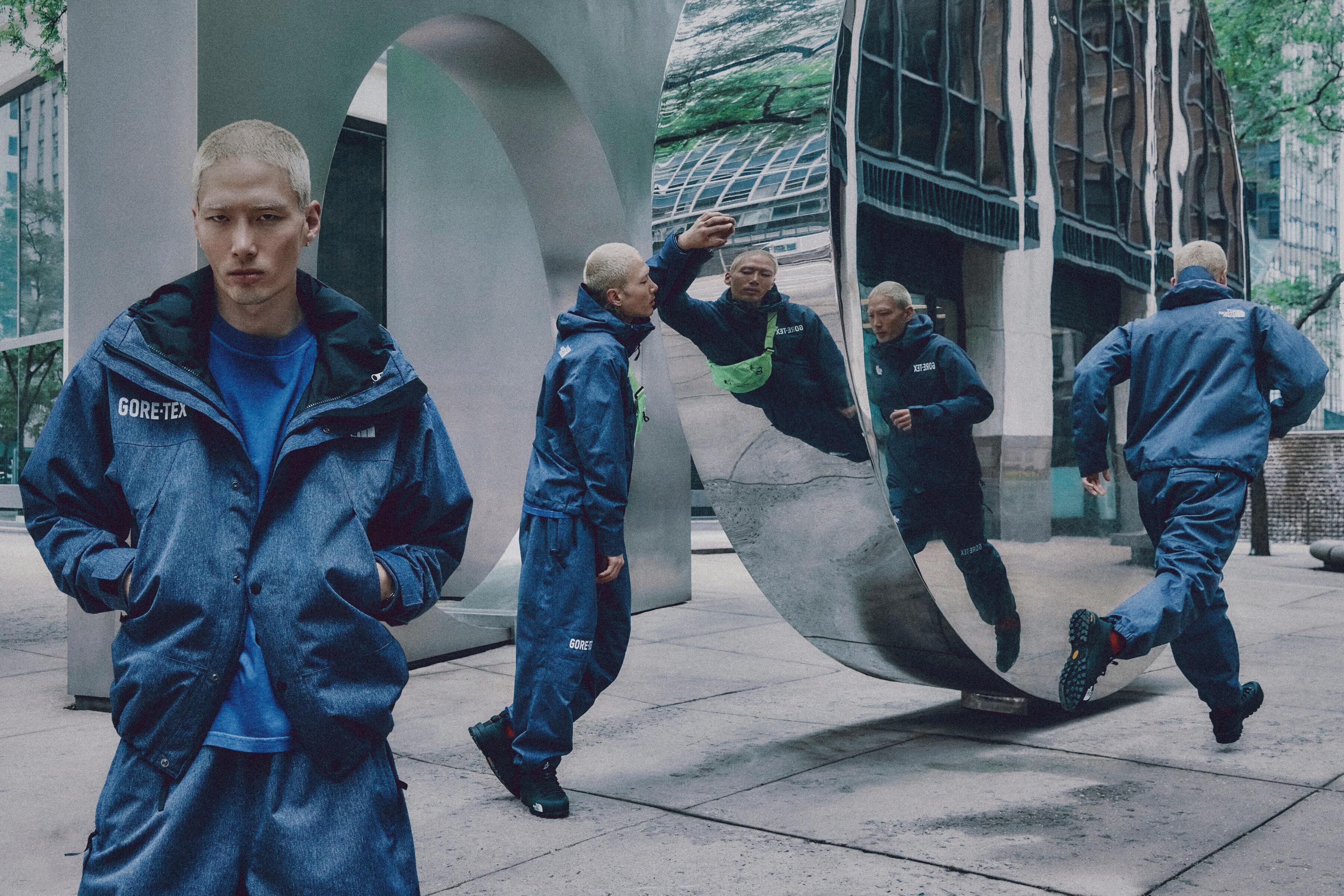 Models wear The North Face's denim GORE-TEX clothing capsule, comprising indigo-dyed jackets, pants, and accessories.