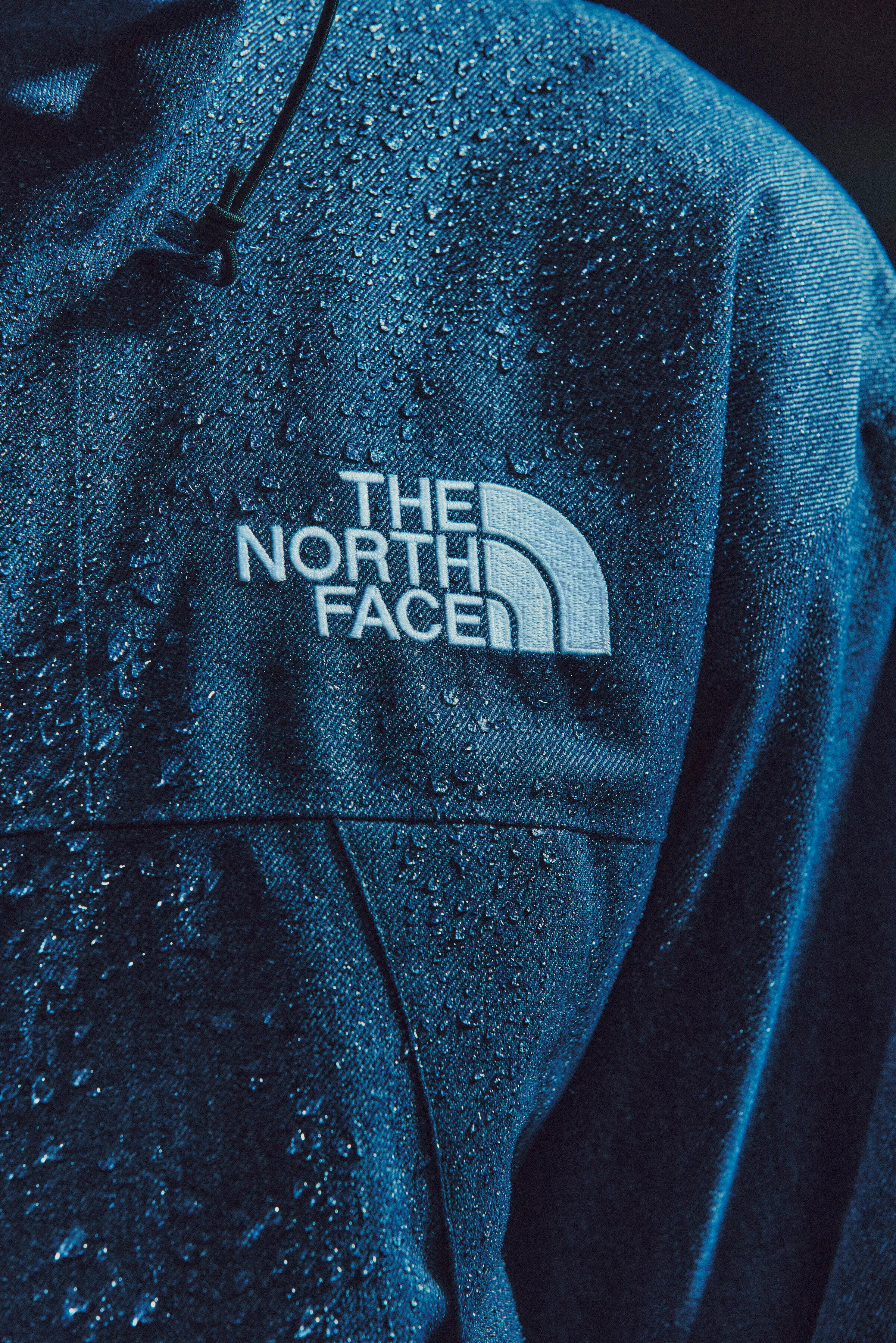 Models wear The North Face's denim GORE-TEX clothing capsule, comprising indigo-dyed jackets, pants, and accessories.