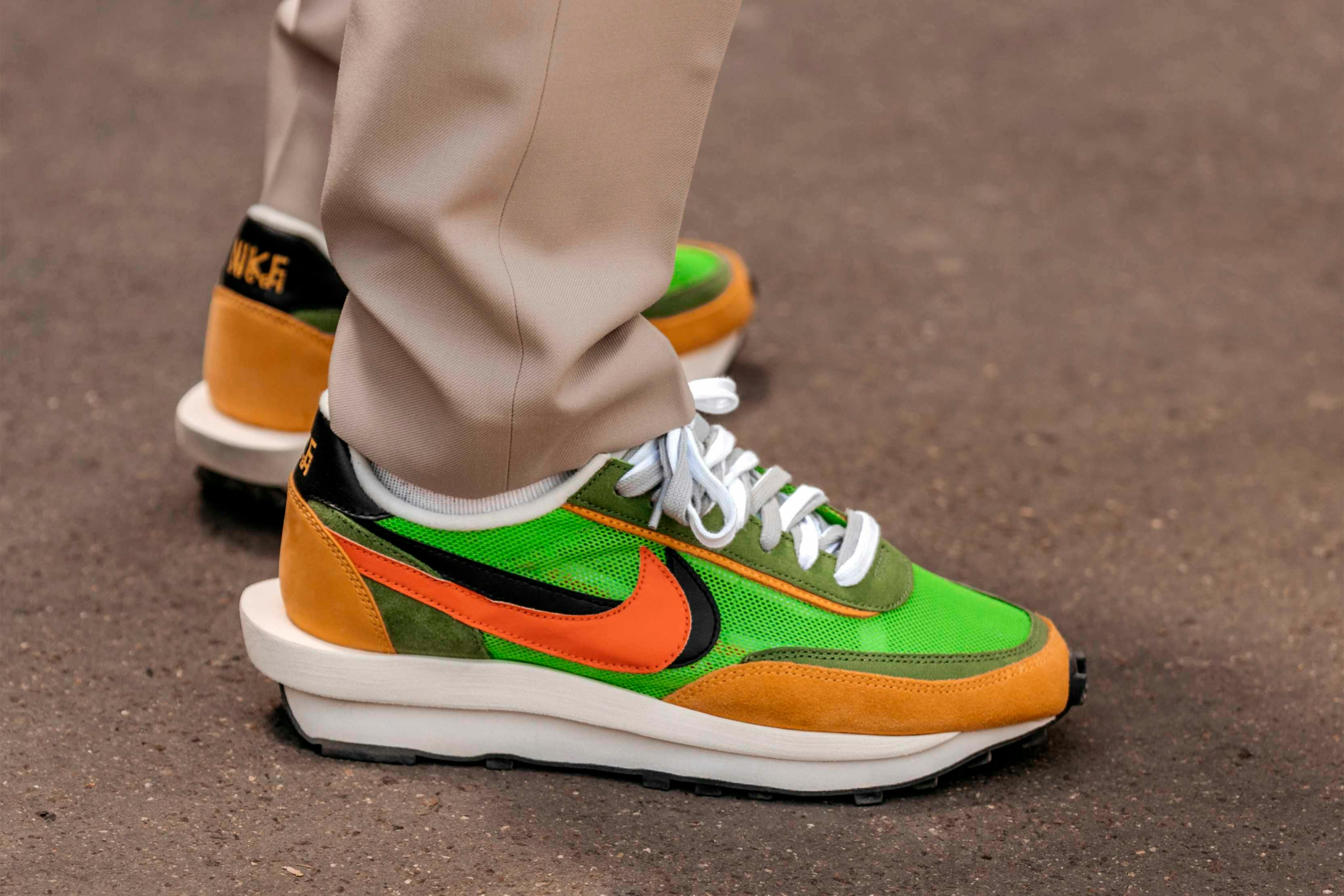 nike sacai ldwaffle sneaker collaboration in green white and yellow colorway worn with beige pants