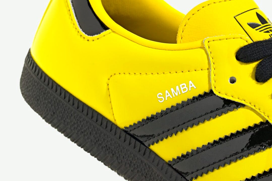 adidas bruce lee samba sneaker in black and yellow leather